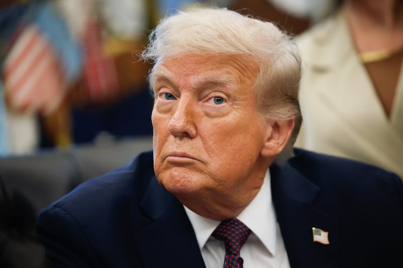 President Donald Trump answers questions from reporters after signing a Presidential Memorandum in the Oval Office on September 15, 2025 in Washington, DC.