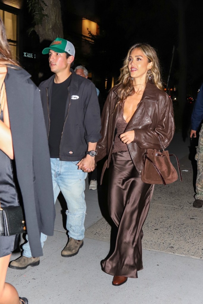 *EXCLUSIVE* New York, NY Jessica Alba enjoyed a rare date night with new boyfriend Danny Ramirez at The Corner Store in New York City, the pair spotted hand-in-hand while joining Marlon Wayans for the evening. Alba stunned in a silky chocolate-brown dress and matching leather jacket, while Ramirez kept it casual in ripped jeans and a cap. Wayans, meanwhile, brought the laughs as he walked alongside the couple.
