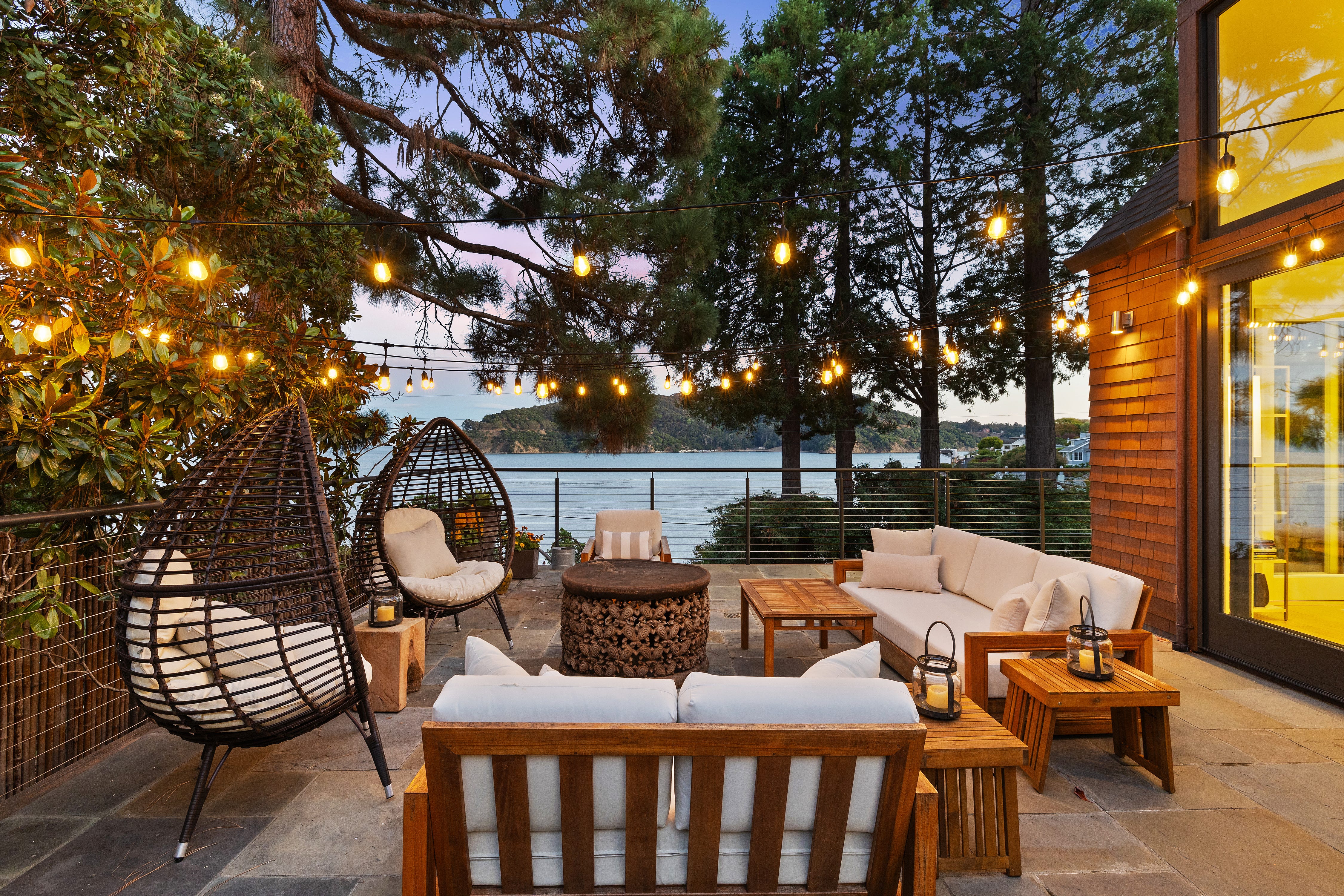 An outdoor patio with a view of the water.