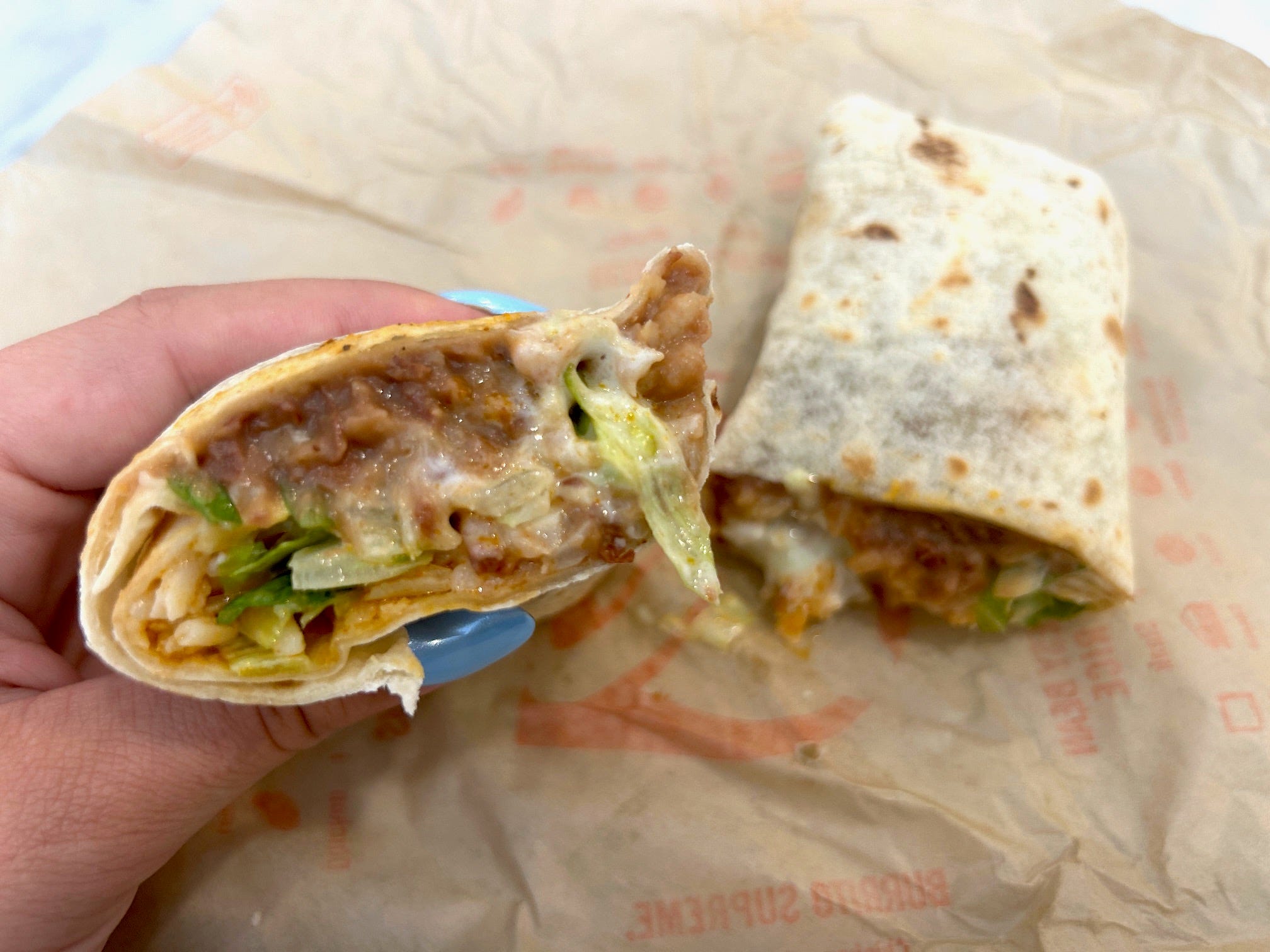 Taco Bell's 7-Layer burrito cut in half