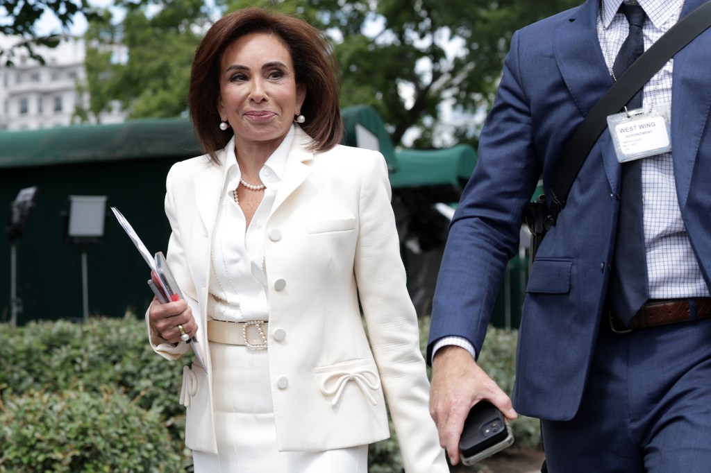 Jeanine Pirro walking near the White House.