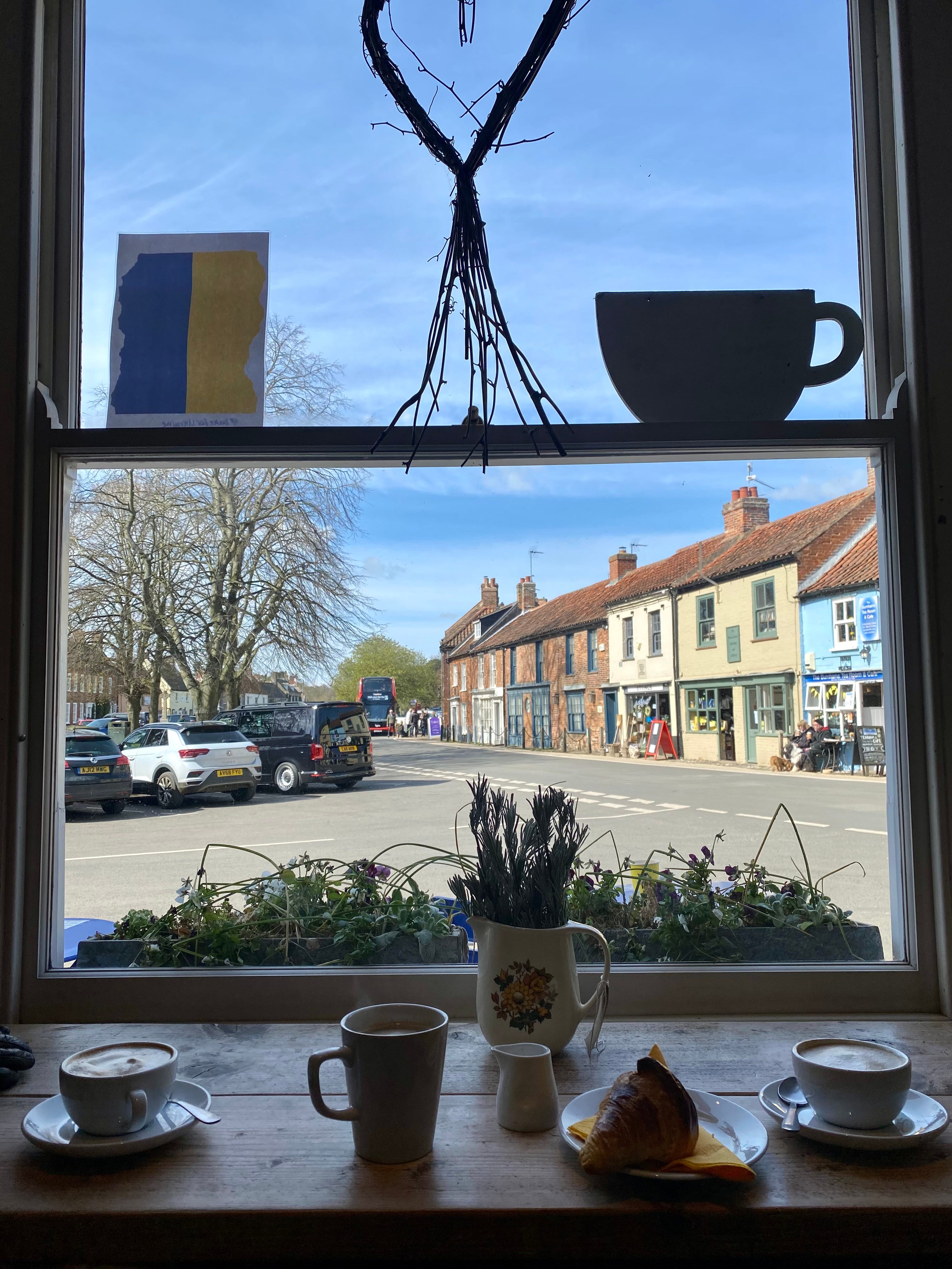 A view out of a window onto a street in Norfolk.