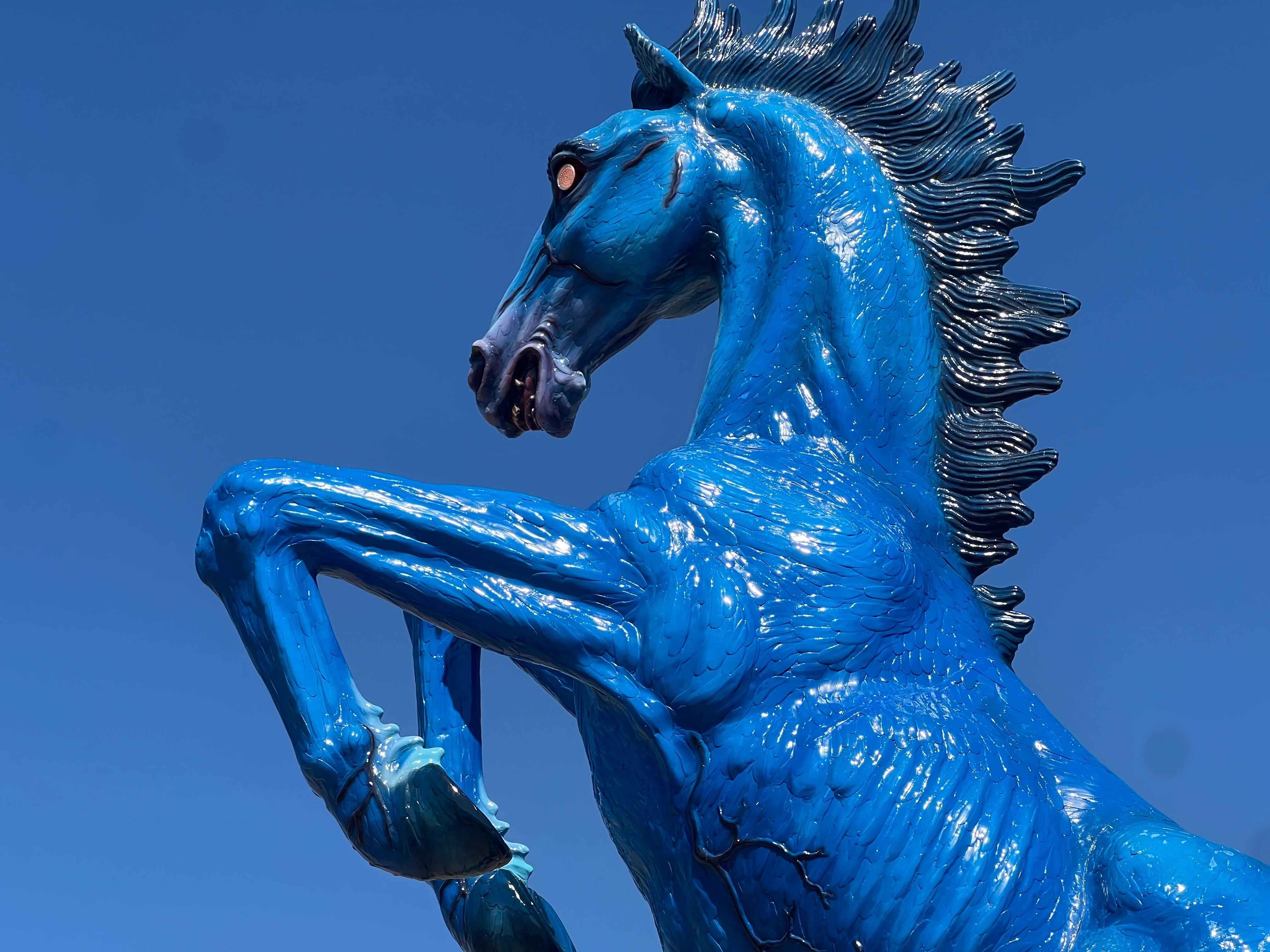 A close-up photo of Mustang, the blue horse statue rearing outside Denver Airport.