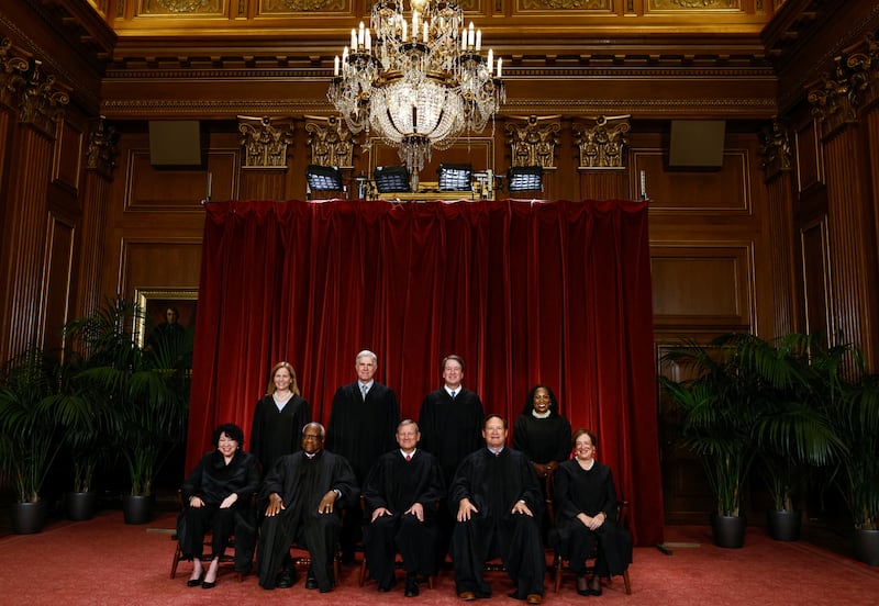 U.S. Supreme Court justices Amy Coney Barrett, Neil Gorsuch, Brett Kavanaugh, Ketanji Brown Jackson, Sonia Sotomayor, Clarence Thomas, Chief Justice John Roberts, Jr., Samuel Alito and Elena Kagan pose for a group portrait in Washington, D.C. on October 7, 2022.
