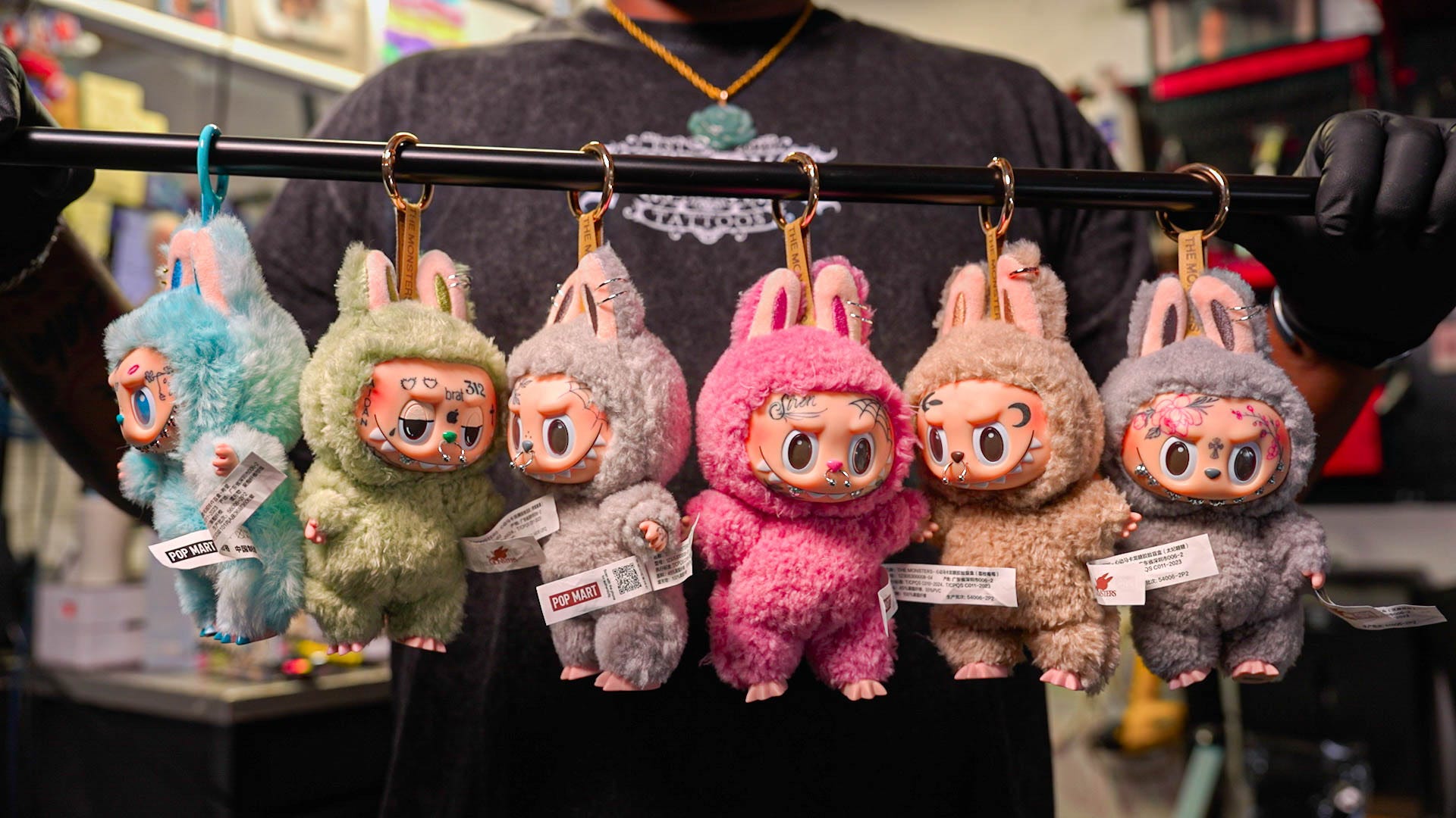 A string of customized Labubus.