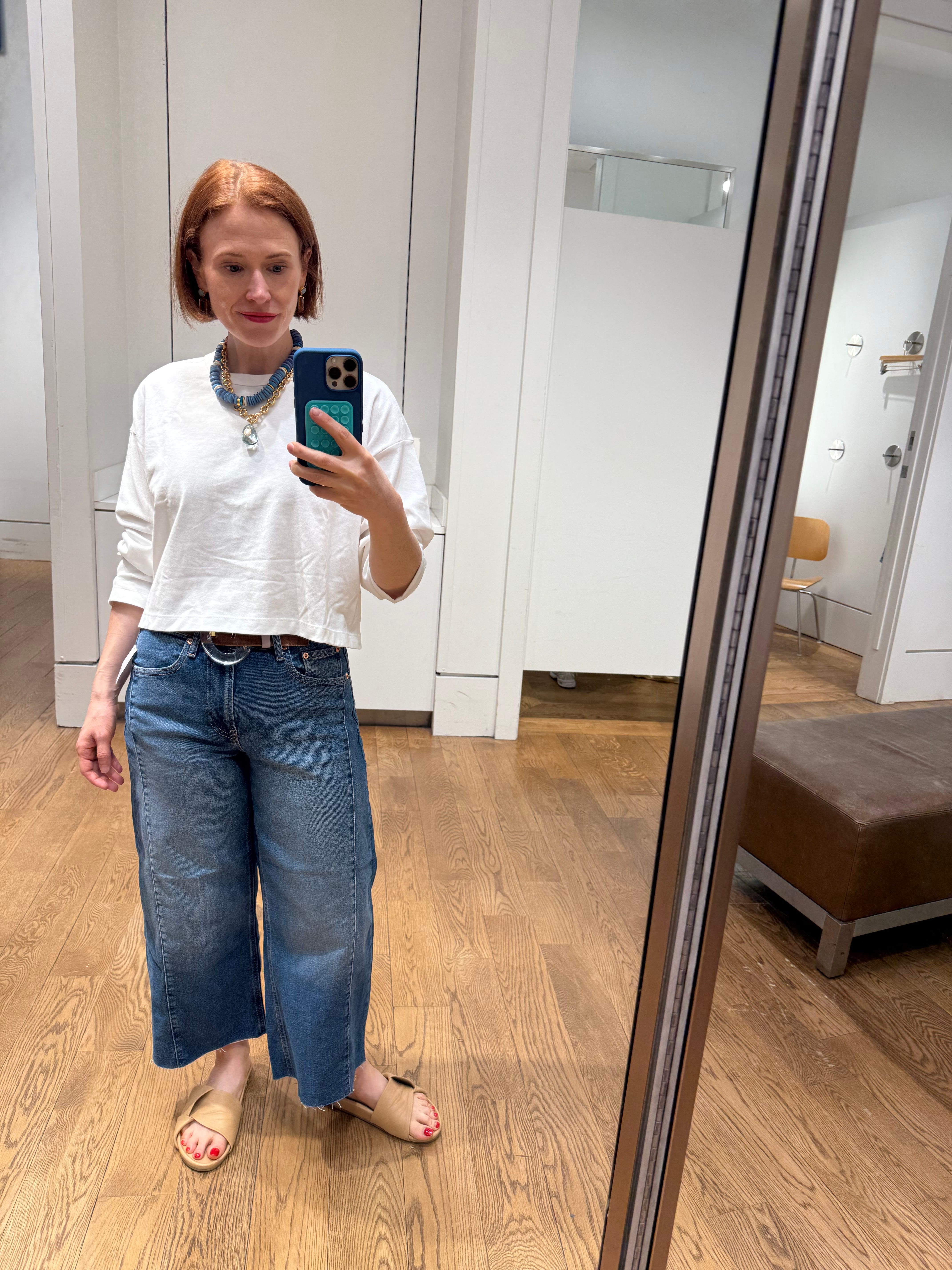 Author Grace Van Cleave wearing mid-rise stride jeans and white shirt  in Gap fitting room