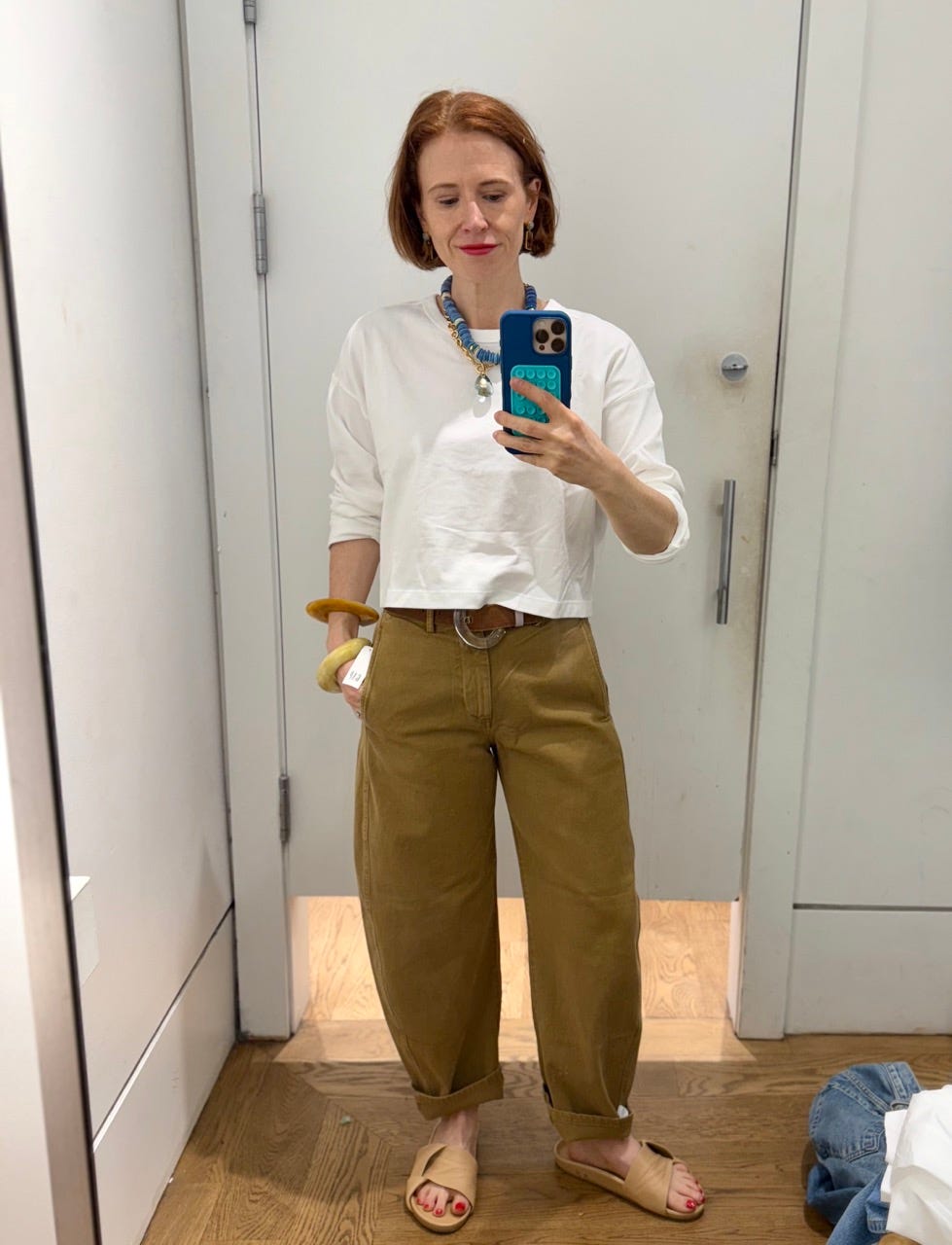 Author Grace Van Cleave wearing barrel twill pants in Gap fitting room