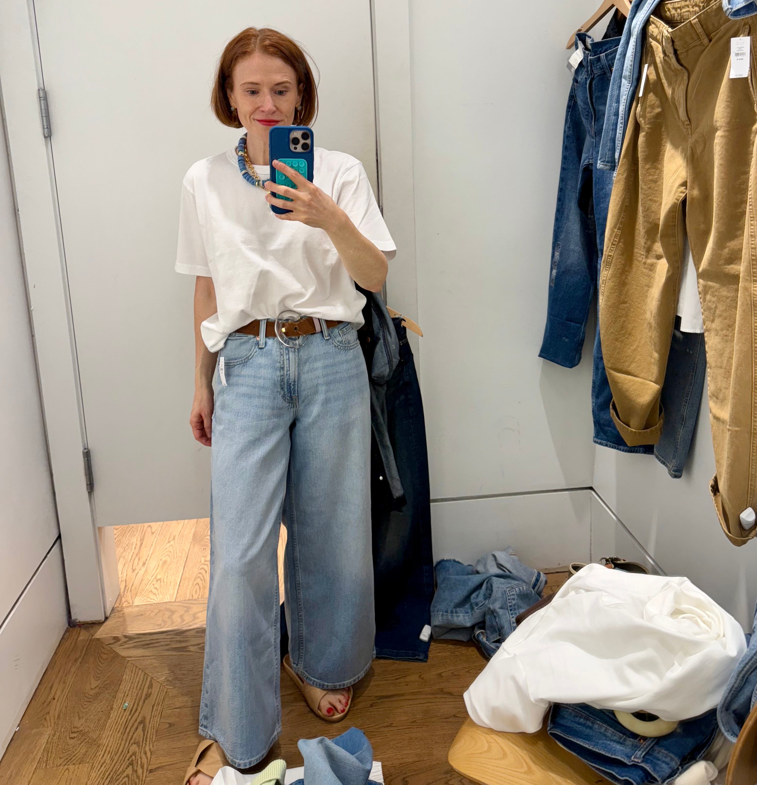 Author Grace Van Cleave wearing classic tee and baggy jeans in Gap fitting room