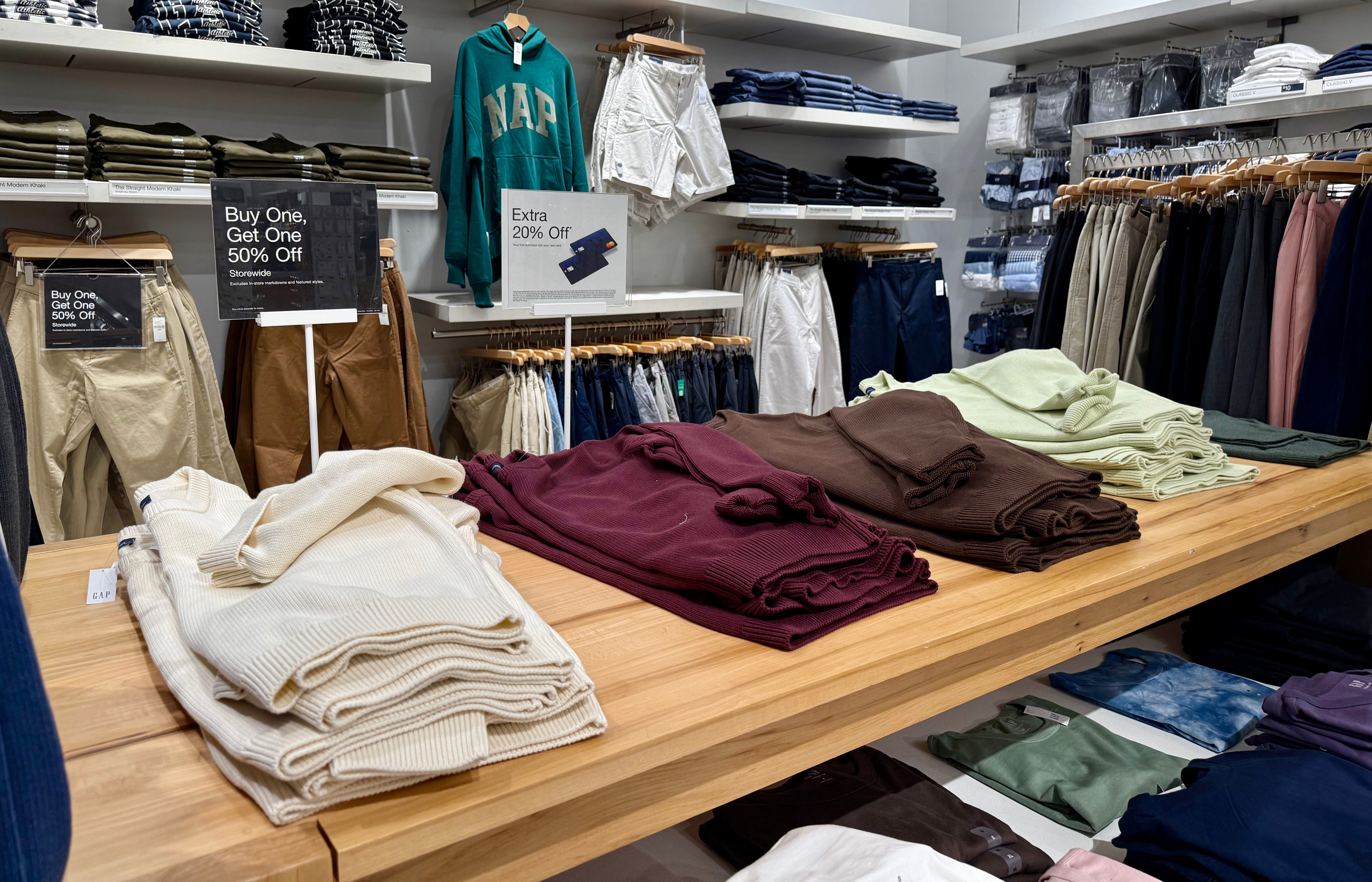 Stacks of mens sweaters at Gap