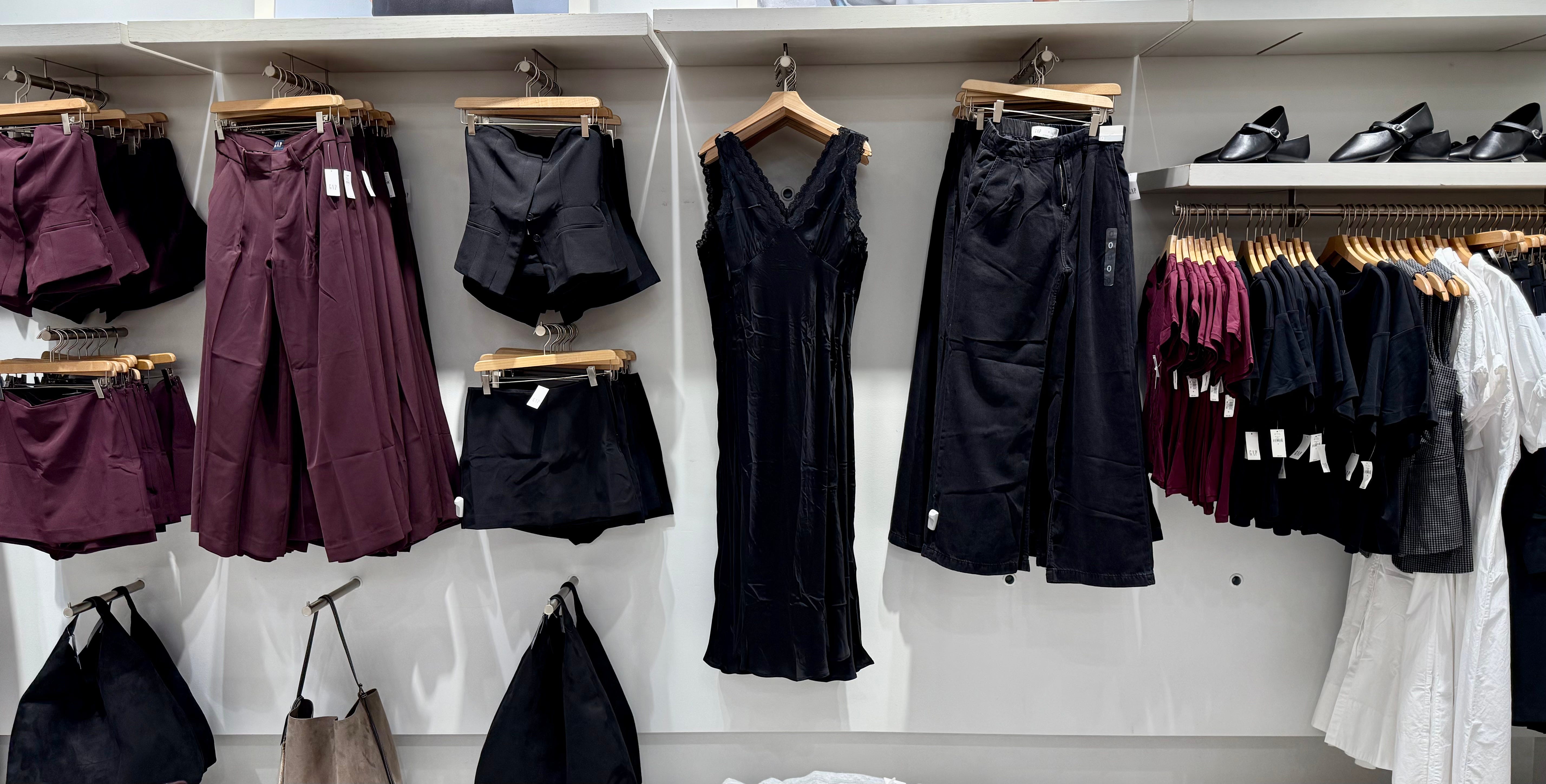Slip dress, shorts, pants, on display on wall in Gap store