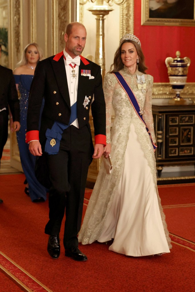 Britain's William, Prince of Wales and Catherine, Princess of Wales walk to attend the State Banquet during U.S. President Donald Trump's state visit.