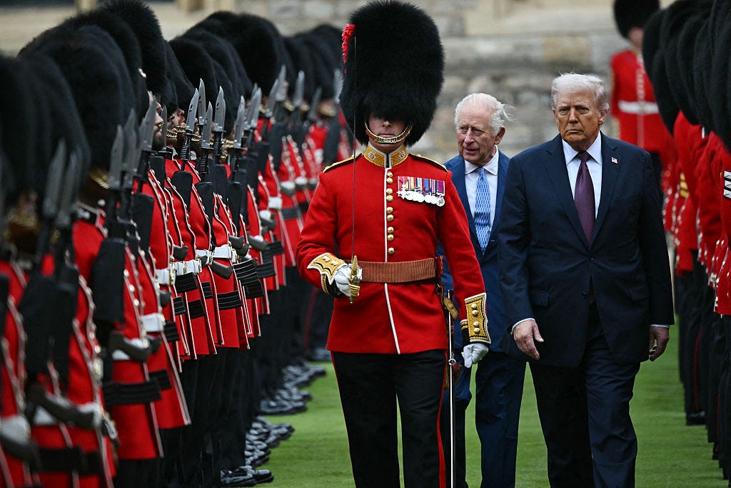 King Charles and President Donald Trump inspect the guard of honour during a UK state visit at Windsor Castle.