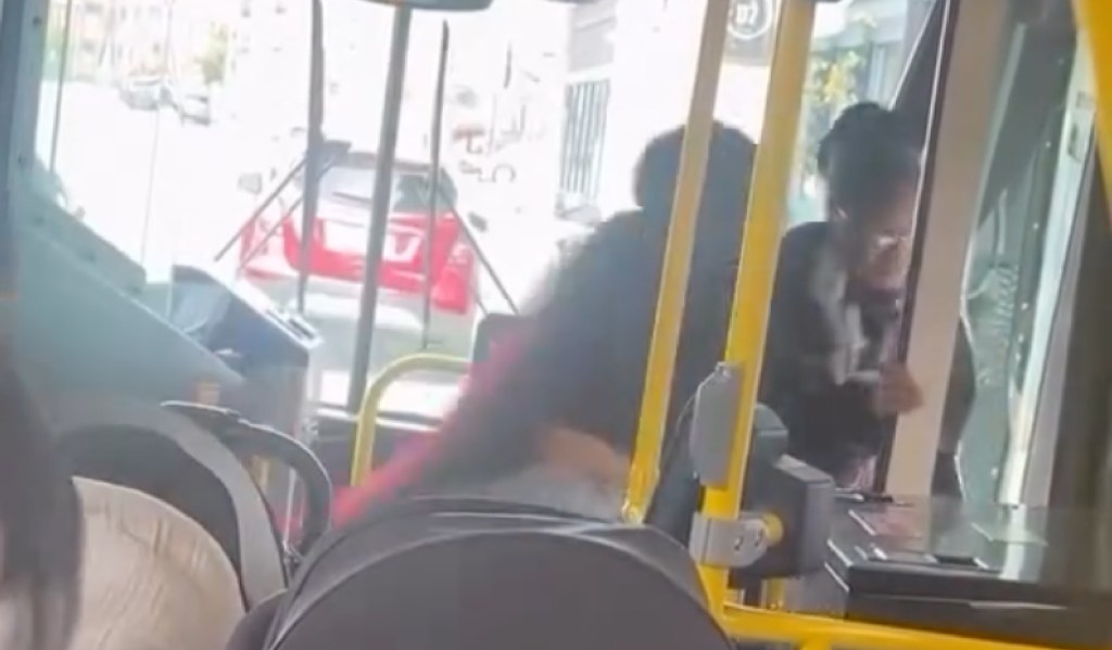 An unhinged commuter has been arrested after a startling video showed her violently shoving an elderly woman off a Boston bus, causing the victim to slam face-first on the sidewalk.