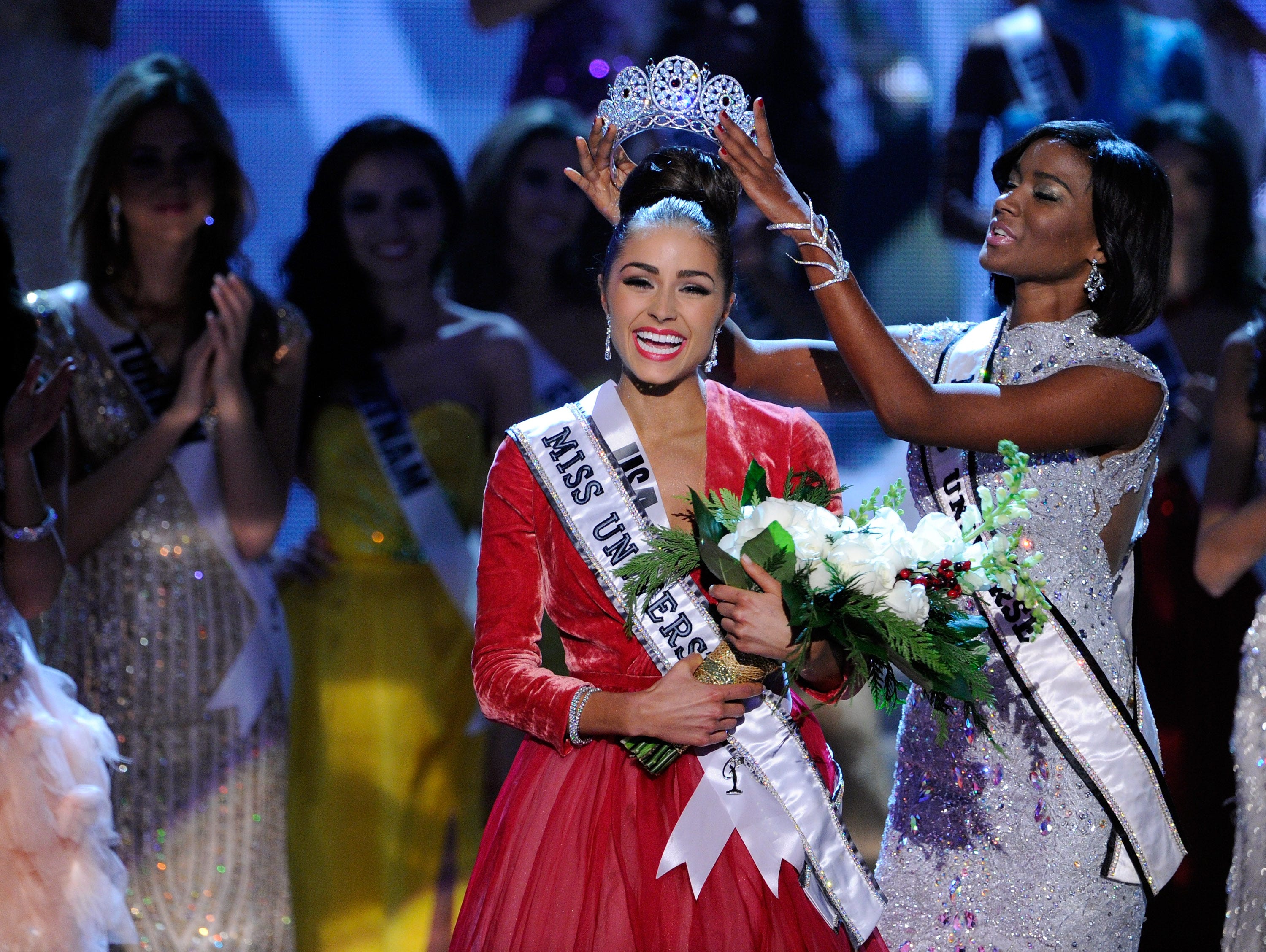 Miss USA 2012, Olivia Culpo (C), reacts as she is crowned the 2012 Miss Universe by Leila Lopes, Miss Universe 2011, during the 2012 Miss Universe Pageant at PH Live at Planet Hollywood Resort & Casino on December 19, 2012 in Las Vegas, Nevada.