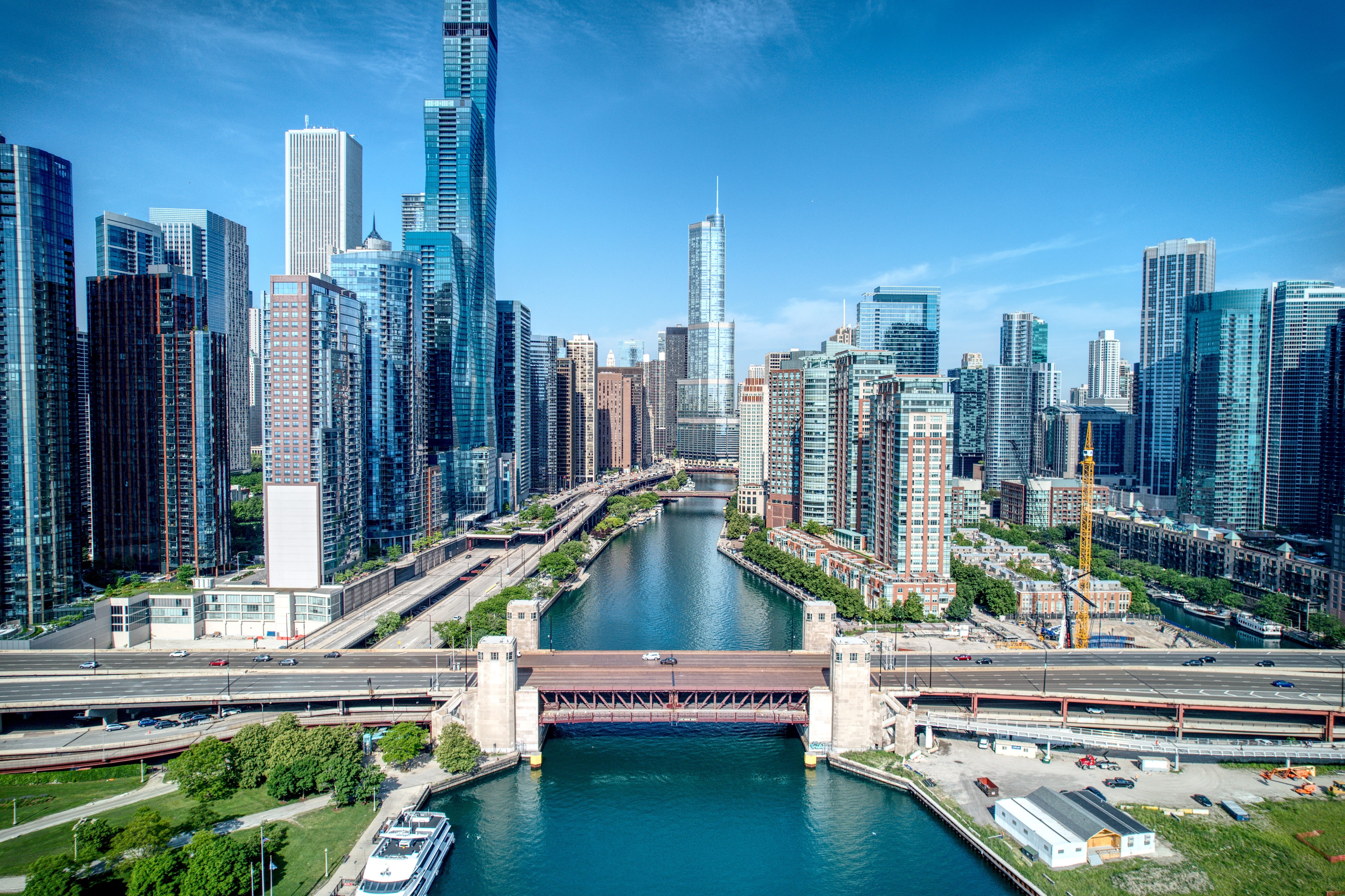 A view of the Chicago skyline with the Chicago River running down the middle of the frame.