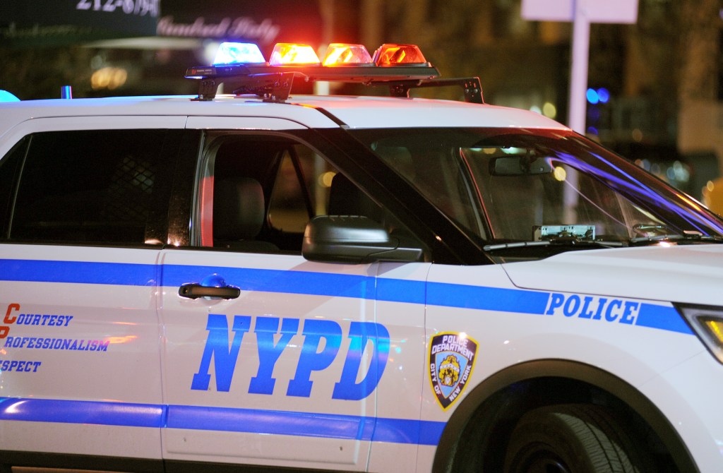 NYPD police car at night.