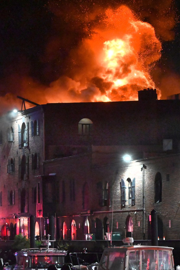 FDNY firefighters battling a three-alarm fire in a Brooklyn building.