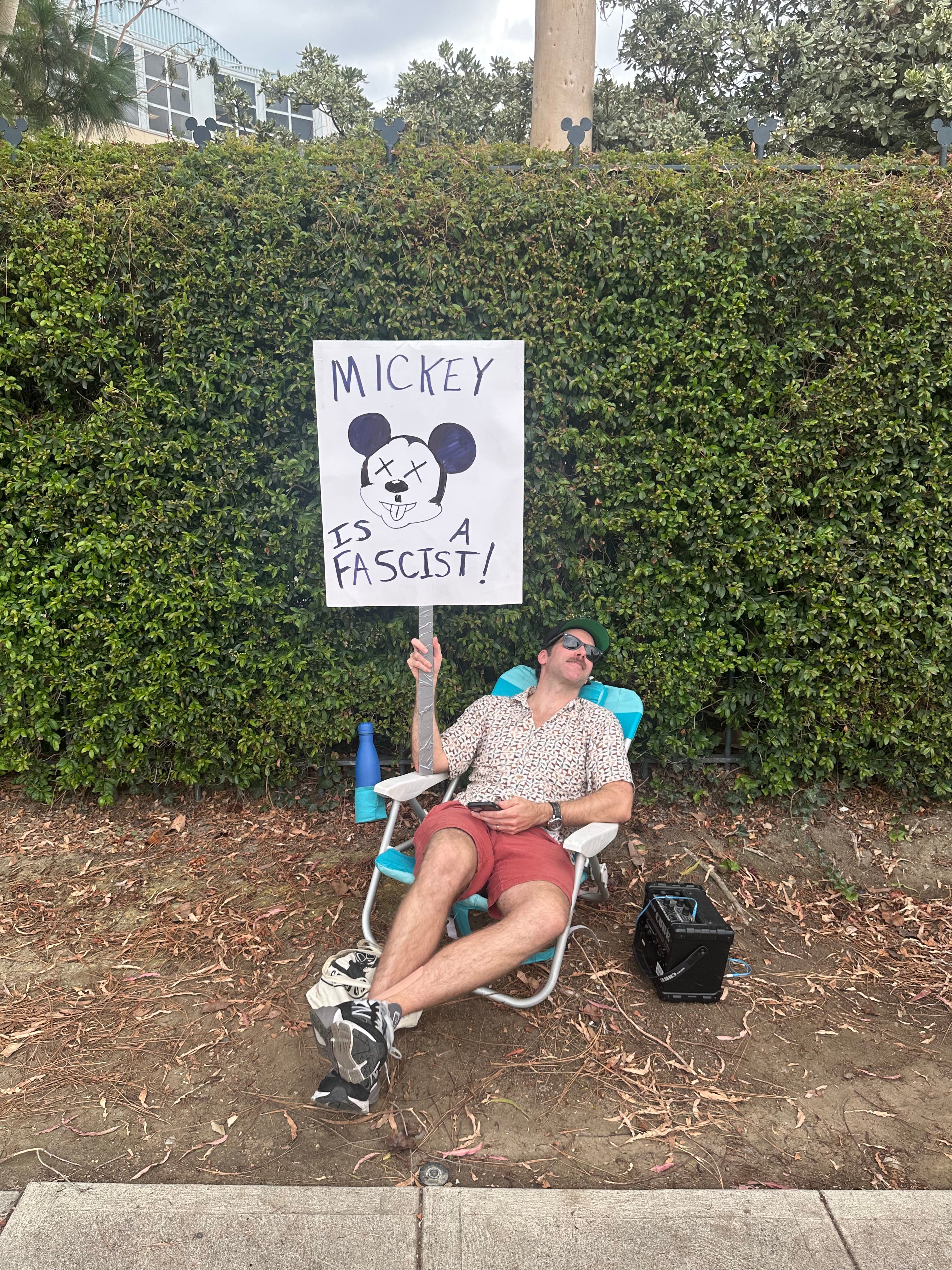 Protestor with a sign that says 