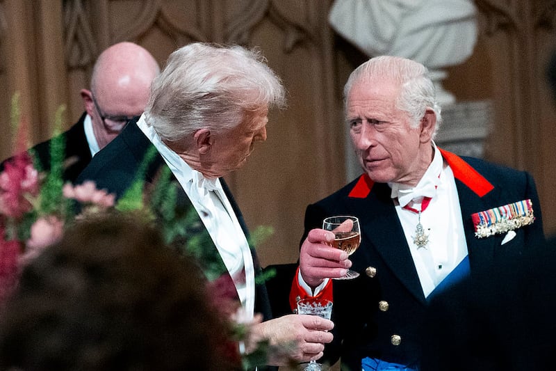 U.S. President Donald Trump speaks with King Charles III  as they attend the State Banquet hosted by King Charles III and members of the Royal Family at Windsor Castle during the state visit by the President of the United States of America on September 17, 2025 in Windsor, England. President Trump is in England from Sept. 16-18 on his second UK state visit, with the previous one taking place in 2019 during his first presidential term.  (Photo by Doug Mills-Pool/Getty Images)