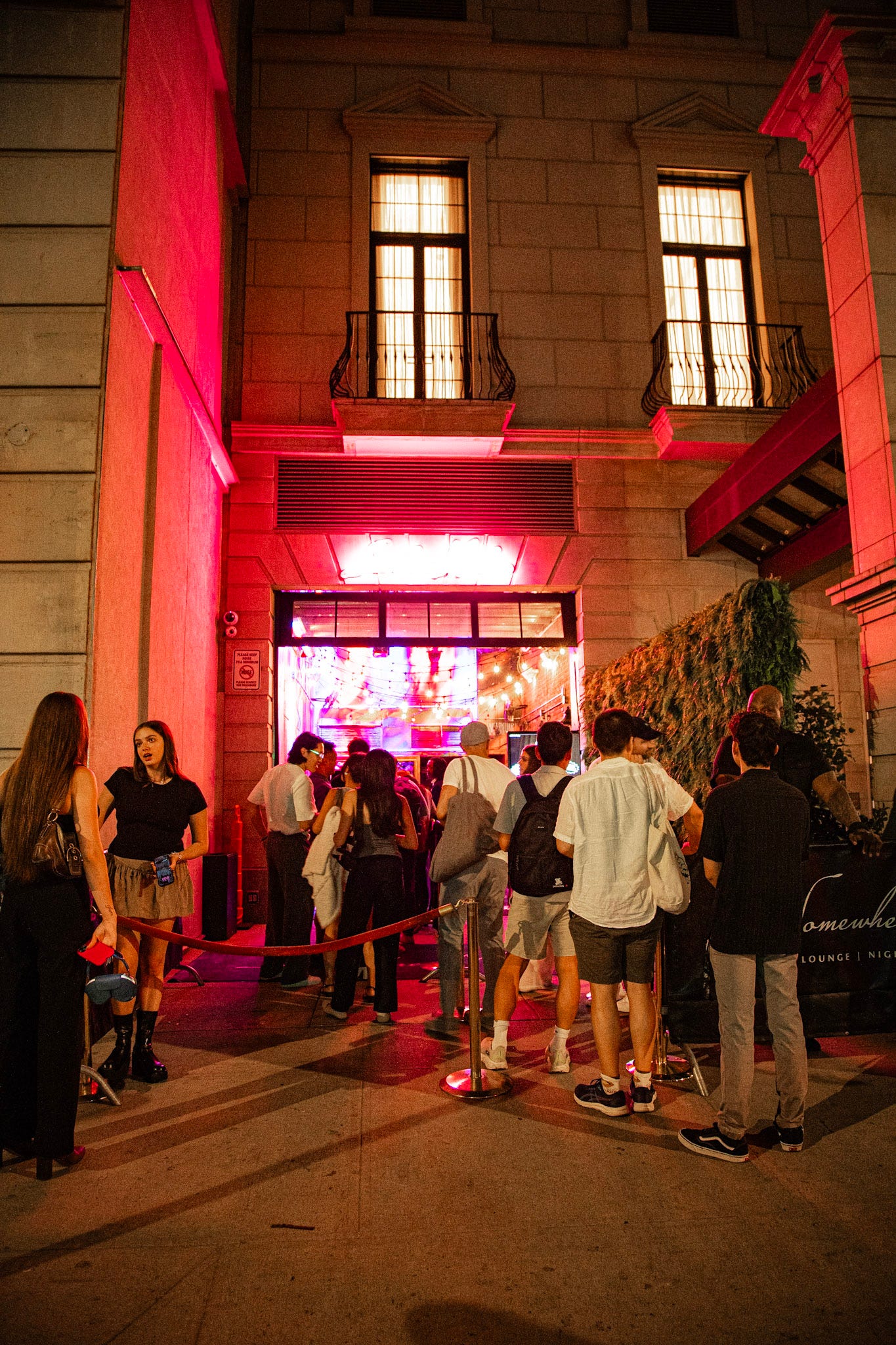 A queue to get into a party.