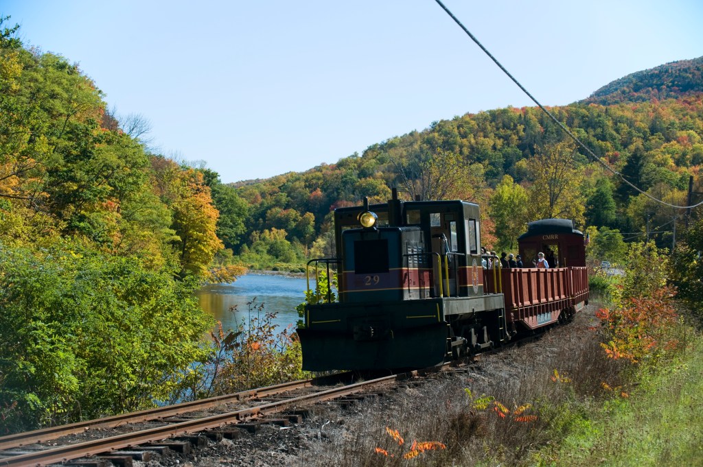 Scenic train ride through autumn foliage along the Esopus Creek in the Catskills.