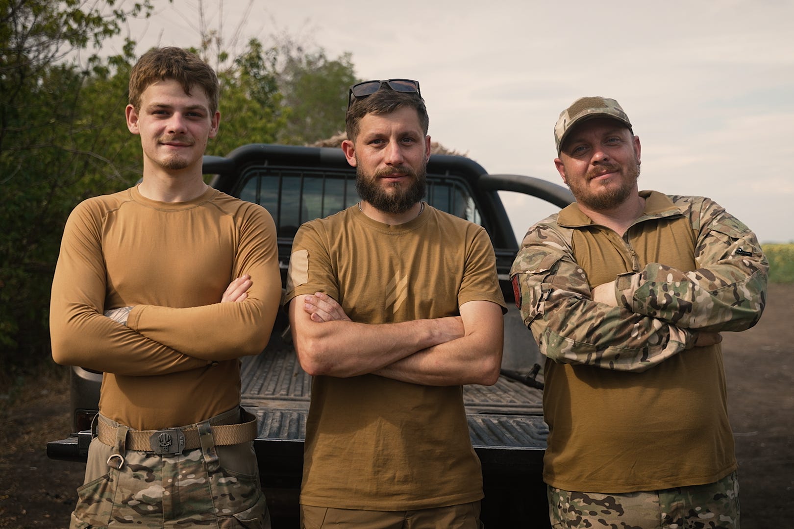 The drone crew of the 3rd Assault Brigade, from left, LaCoste, Major and Vladyka, stand at a hidden training site 20 miles from the front lines in eastern Ukraine.