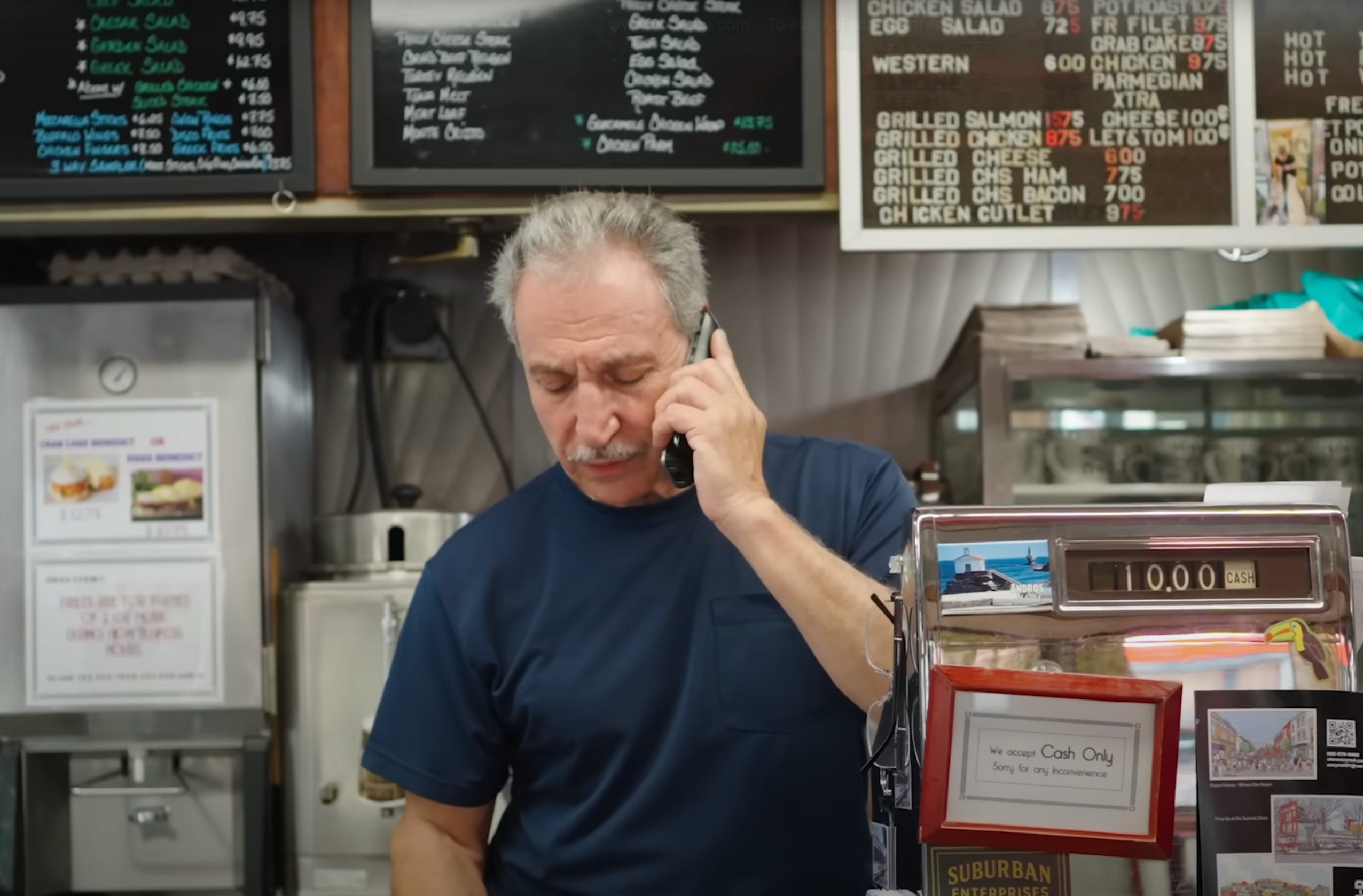 Jimmy in front of menu board summit diner
