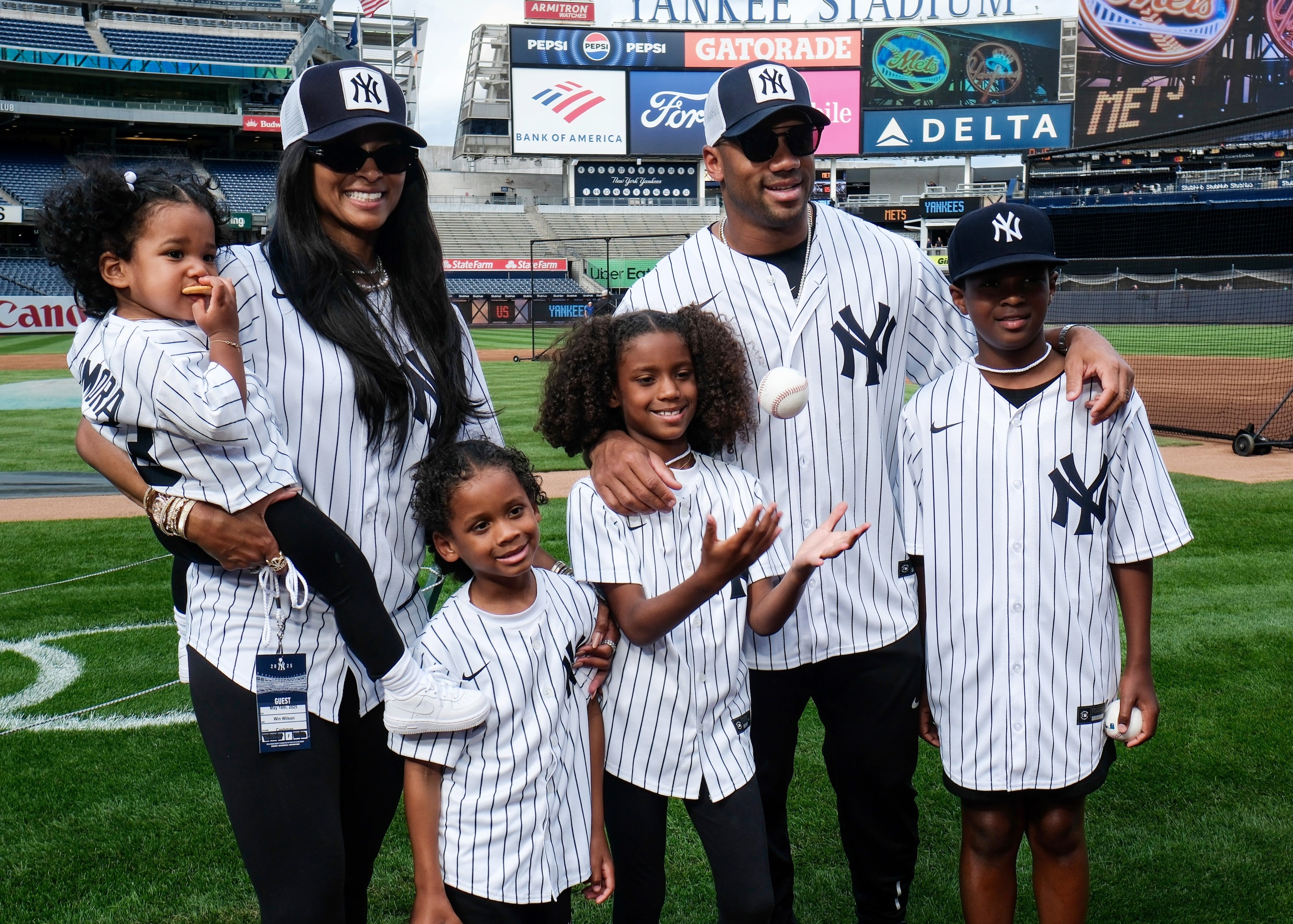 Ciara and Russell Wilson and his family pose for a photo prior to a game between the New York Mets and the New York Yankees at Yankee Stadium on Sunday, May 18, 2025.