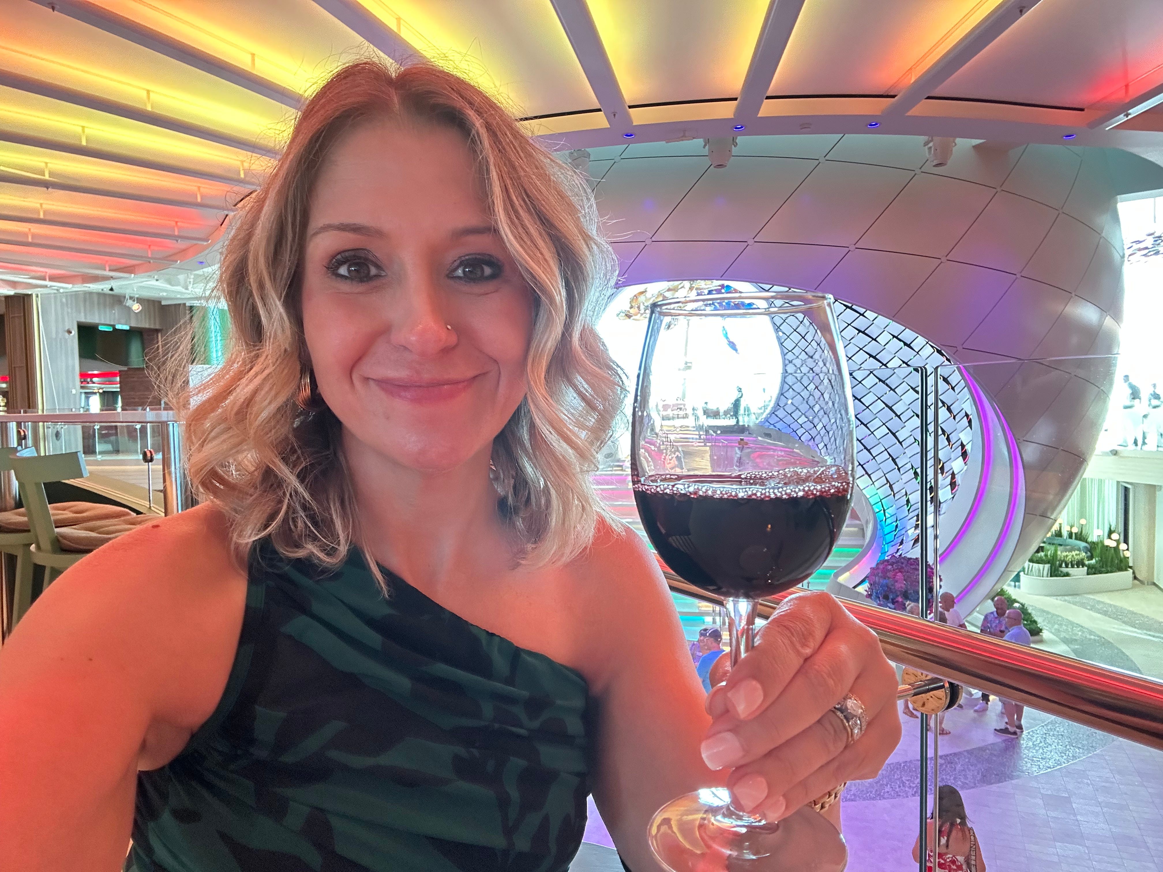 The author drinking non-alcoholic wine aboard the Star of the Seas.