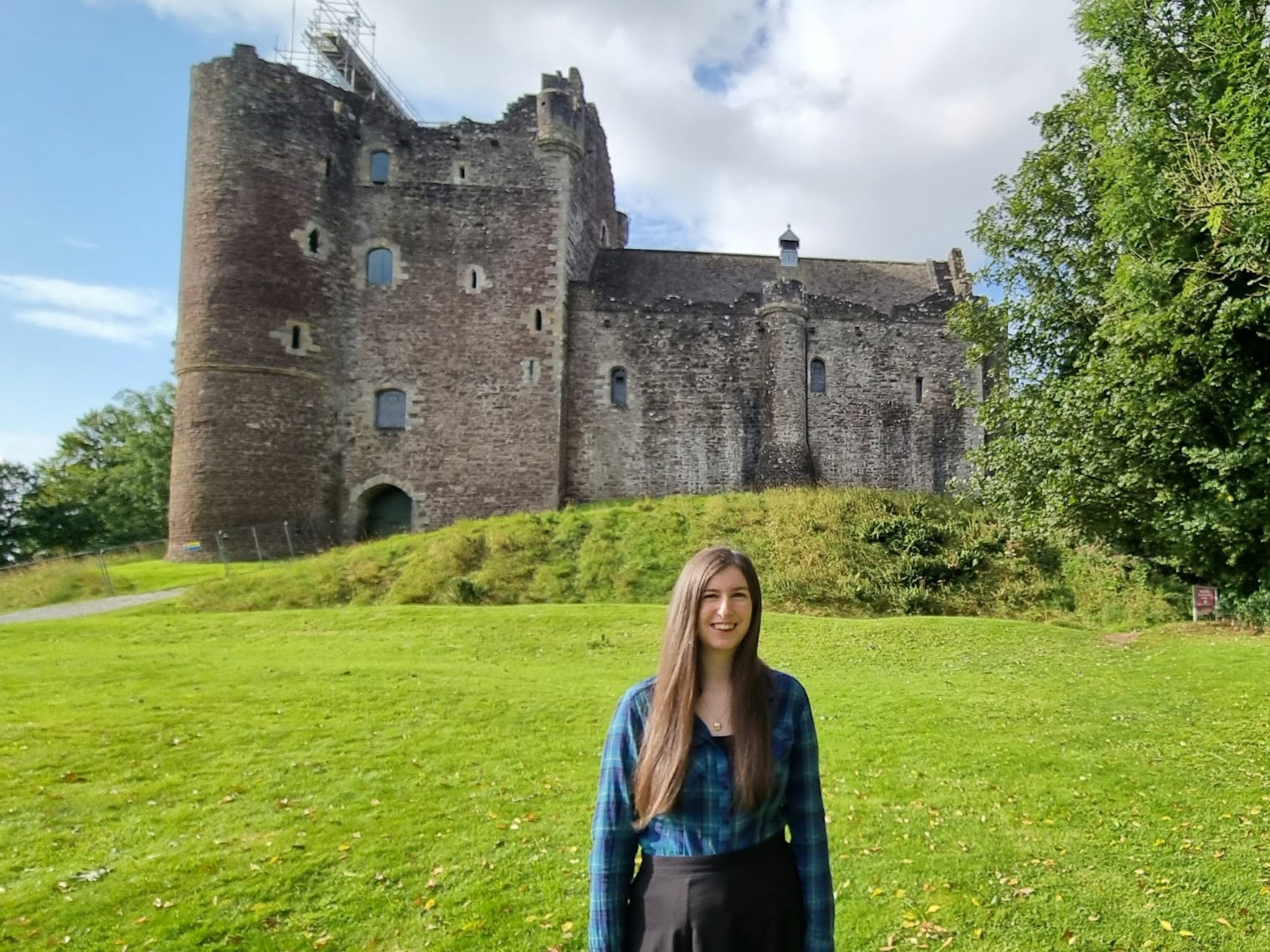 The writer in front of Doune Castle in Scotland.