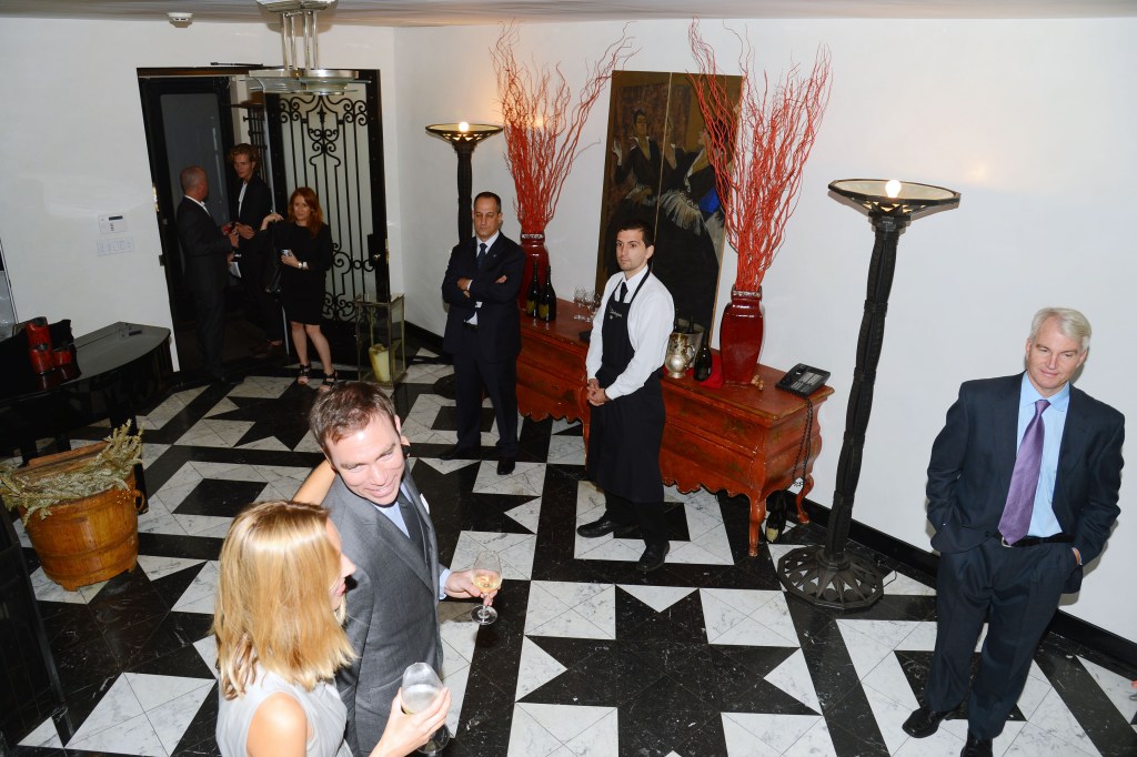 Guests and staff at a cocktail reception for Ideapod.