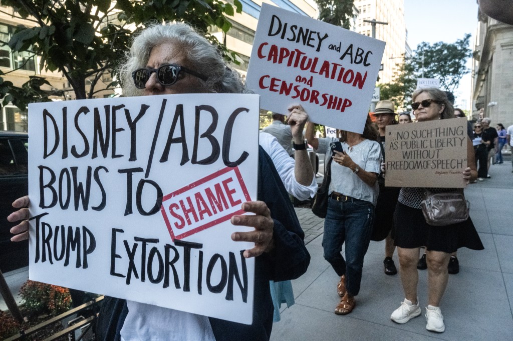 People participate in a protest, organized by the Writers Guild of America East, against ABC's decision to suspend Jimmy Kimmel from his late night show.
