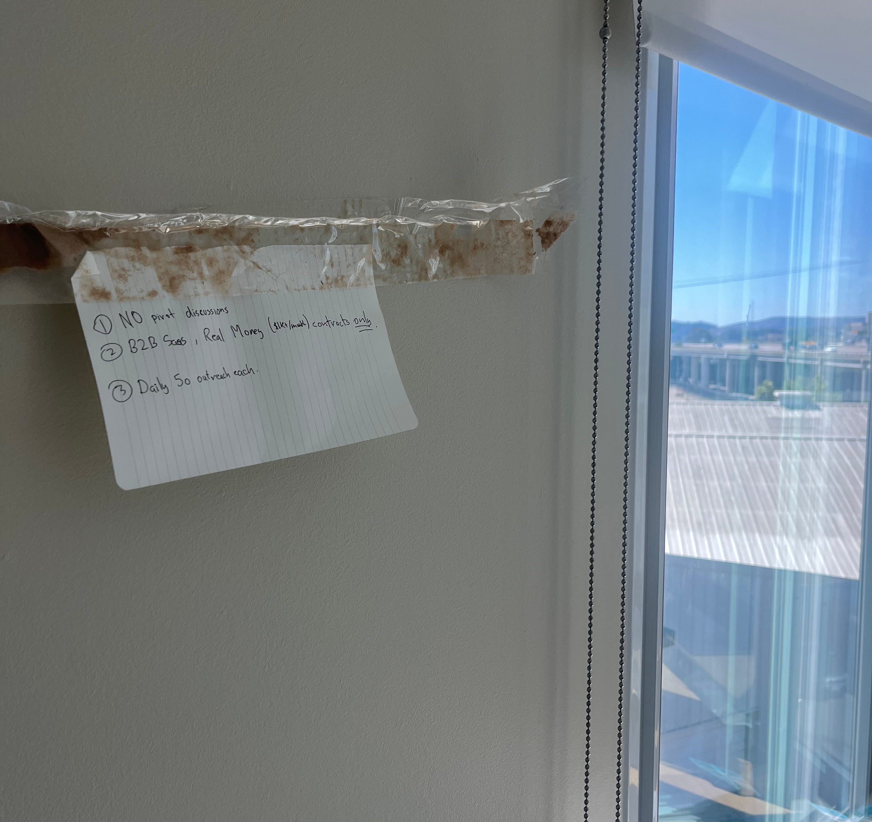 A piece of paper with Docket's three tenets is pictured taped to the wall.