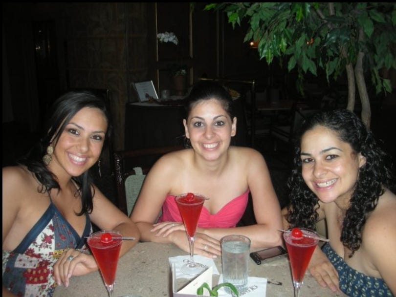 The author poses with her sisters in 2009.