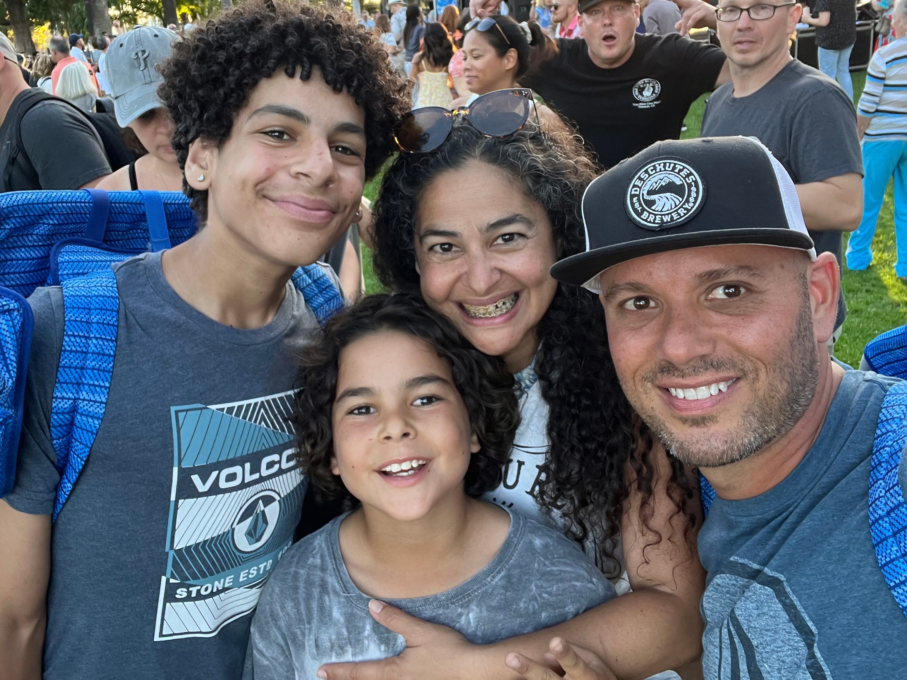 The author and her family pose at an outdoor music venue.