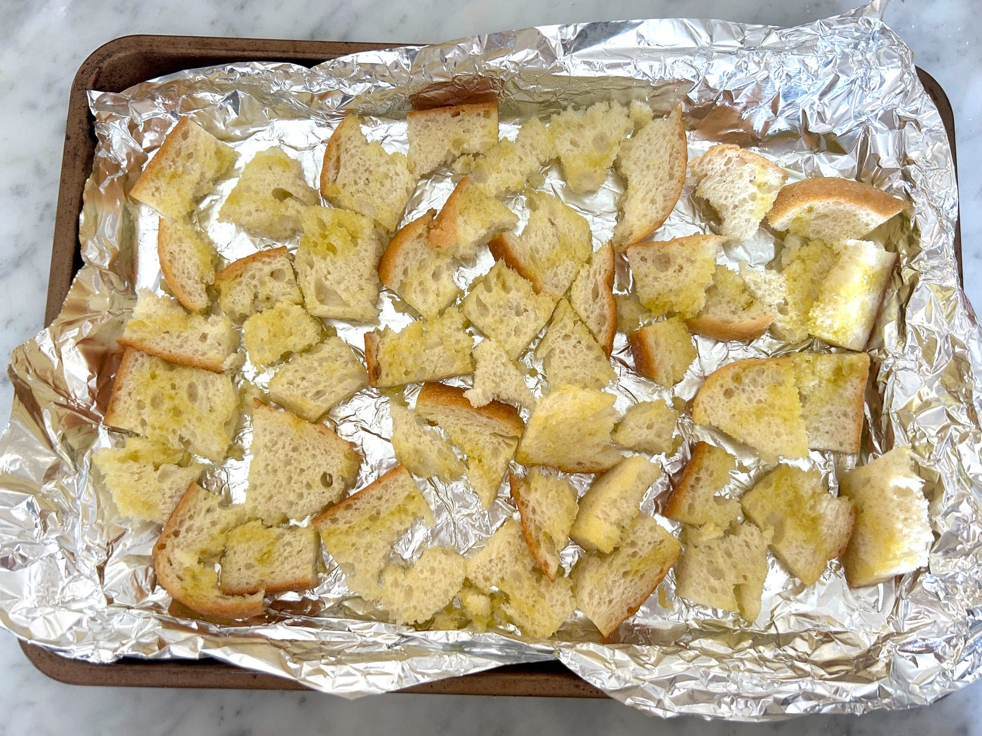 Making homemade croutons for Meghan Markle's Roasted Chicken and Bread Salad