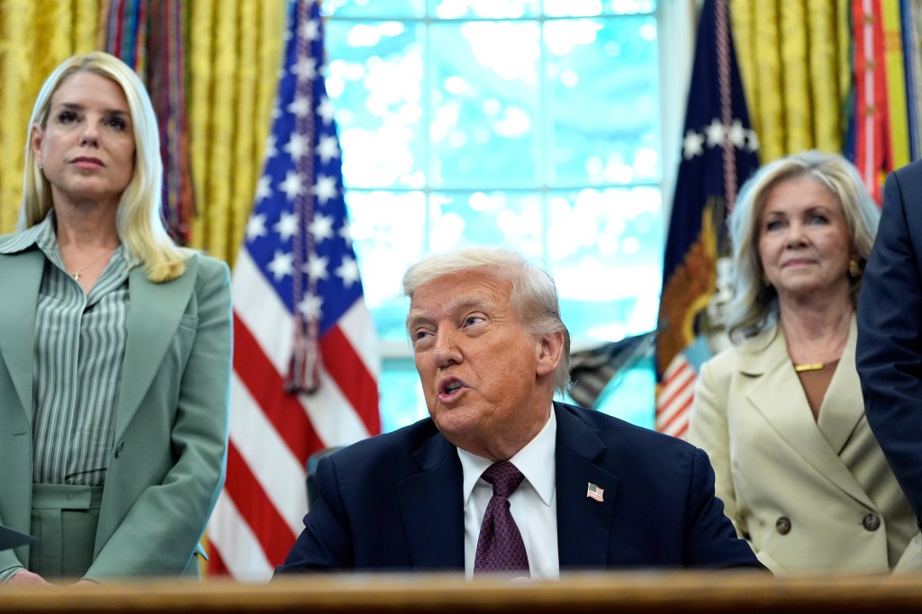 Donald Trump speaks as Attorney General Pam Bondi and Senator Marsha Blackburn listen in the Oval Office.