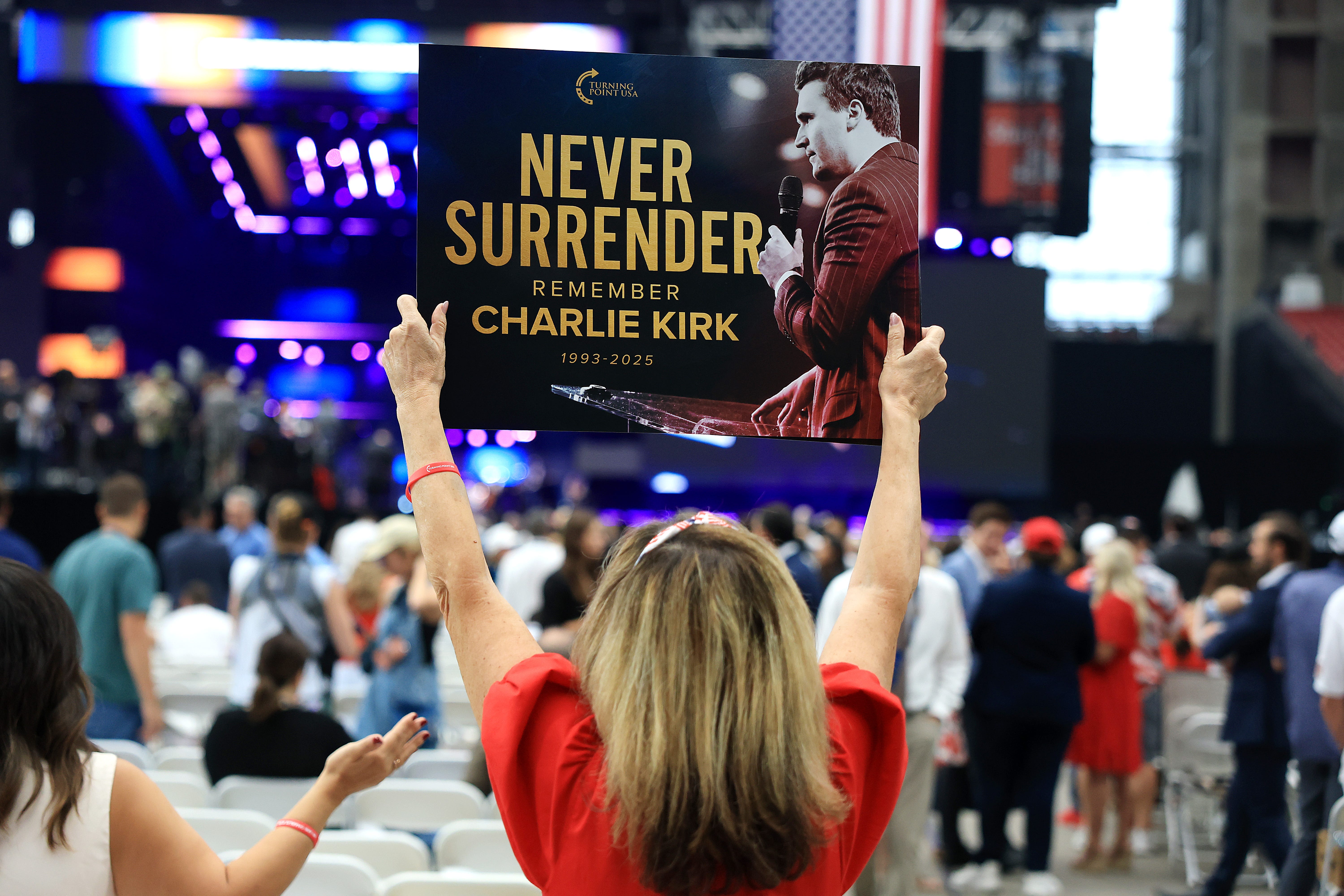 Woman attends Charlie Kirk's memorial service on September 21, 2025.