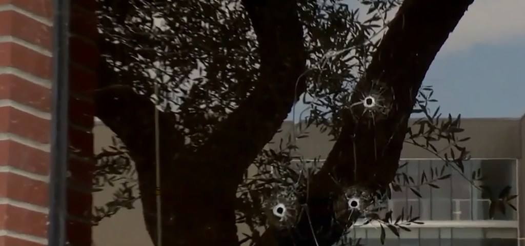 Bullet holes are seen in the lobby window of ABC10’s Sacramento headquarters after Friday’s drive-by shooting.