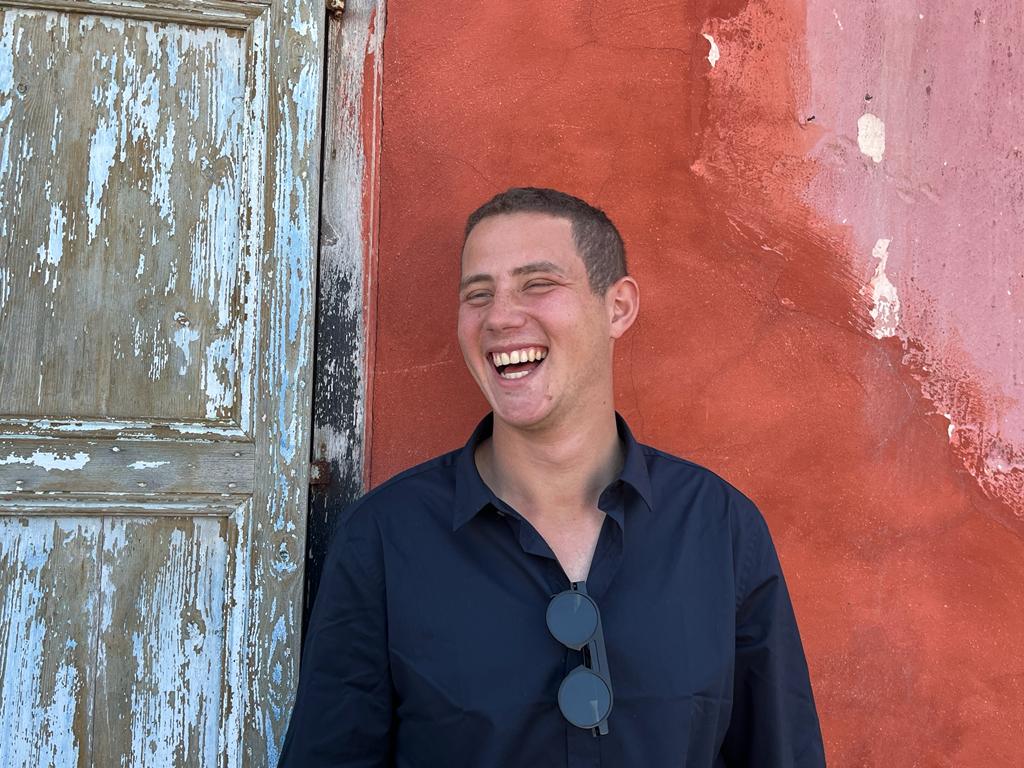 Omer Neutra laughing in a family photo.