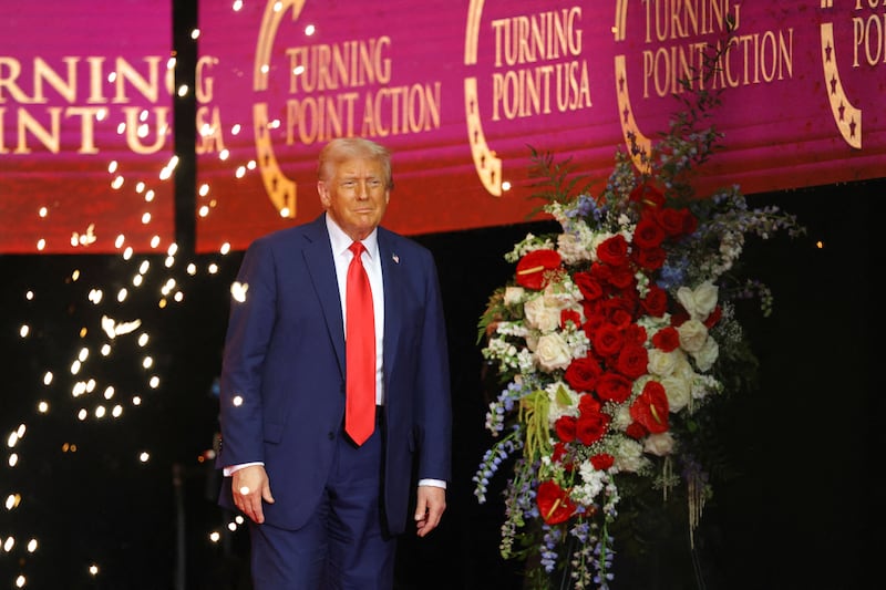 President Donald Trump stands on stage during a memorial service for slain conservative commentator Charlie Kirk, at State Farm Stadium in Arizona, U.S., September 21, 2025