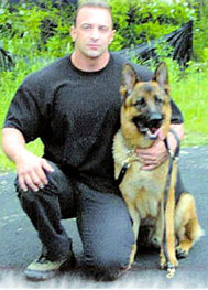 Nicholas Tartaglione with his K-9 partner.