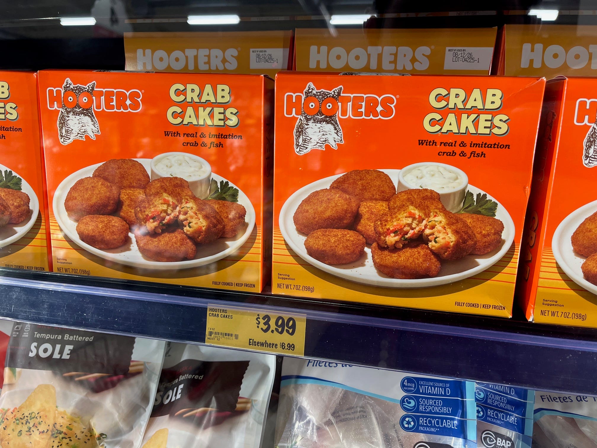 Hooters-branded Crab Cakes sit in the freezer section of a Grocery Outlet store.