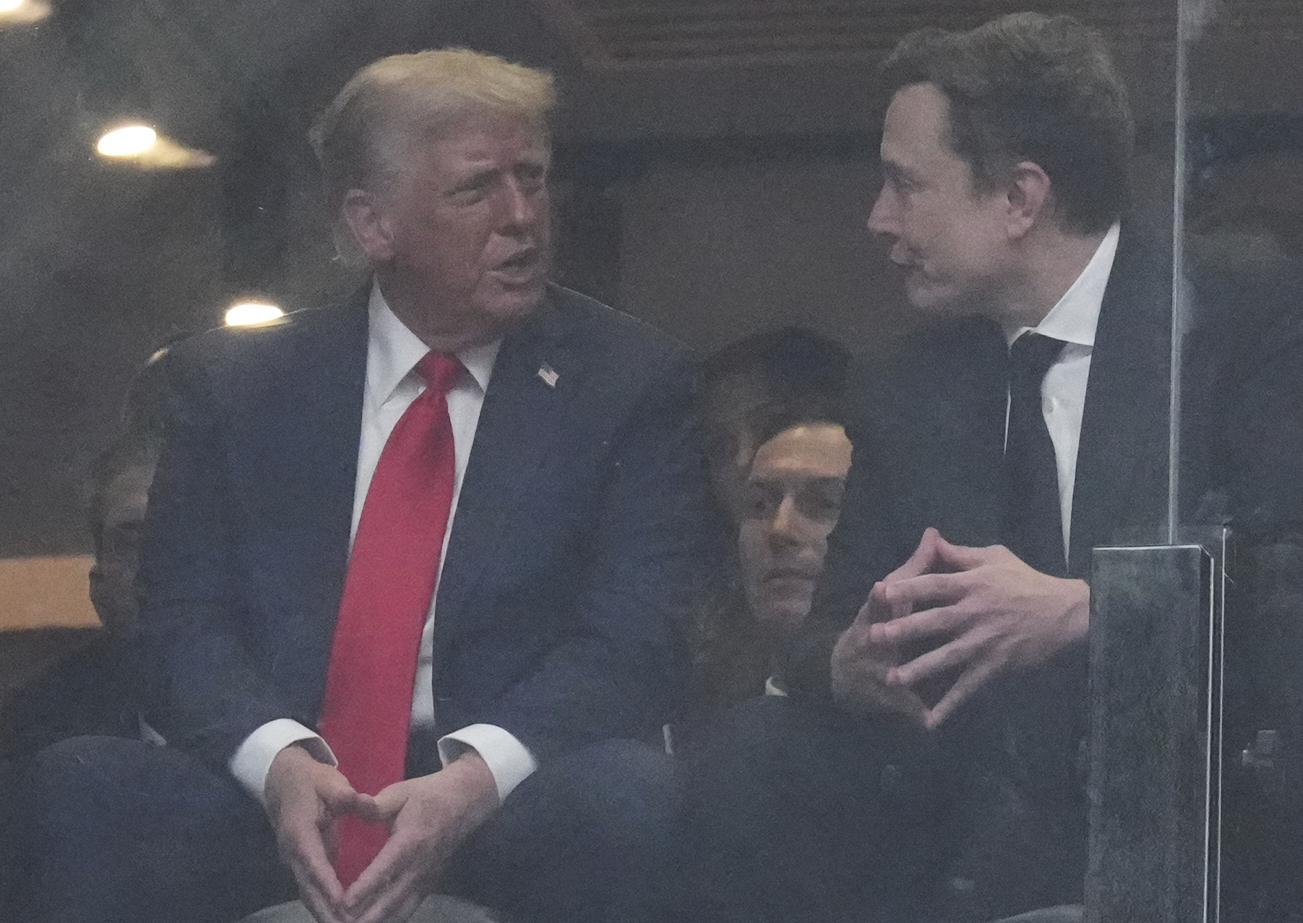 Donald Trump and Elon Musk talking.