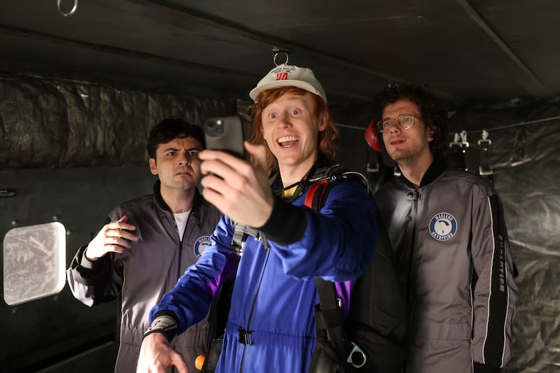 SATURDAY NIGHT LIVE -- Episode 1868 -- Pictured: (l-r) John Higgins, Ben Marshall, and Martin Herlihy during the "Skydiving" sketch on Saturday, October 19, 2024 -- (Photo by: Holland Rainwater/NBC via Getty Images)