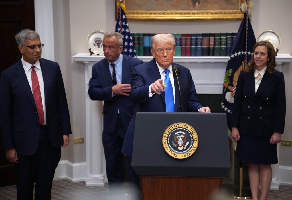 President Donald Trump (C) answers questions after making an announcement on significant medical and scientific findings for Americas children in the Roosevelt Room of the White House on September 22, 2025 in Washington, DC.