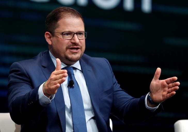 FILE PHOTO: Cristiano Amon, president of Qualcomm and Qualcomm CDMA Technologies, responds to a question during a panel discussion on 5G wireless broadband technology during the 2018 CES in Las Vegas, Nevada, U.S. January 10, 2018. REUTERS/Steve Marcus