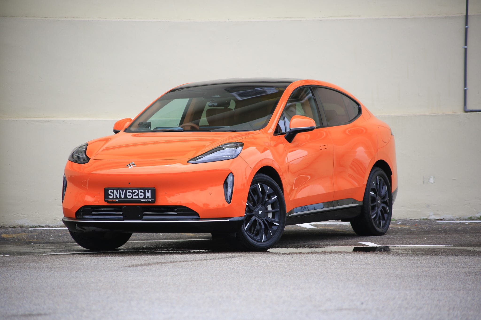 Hyptec HT, a midsize SUV in a bright orange color.