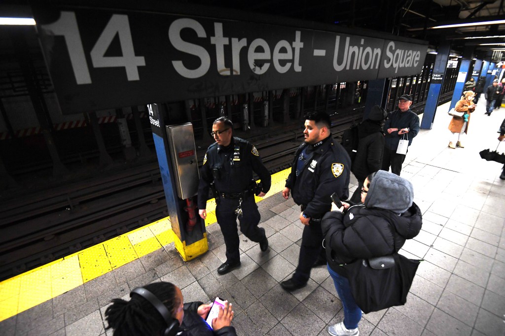 NYPD officers patrolling the 14th Street-Union Square subway station.
