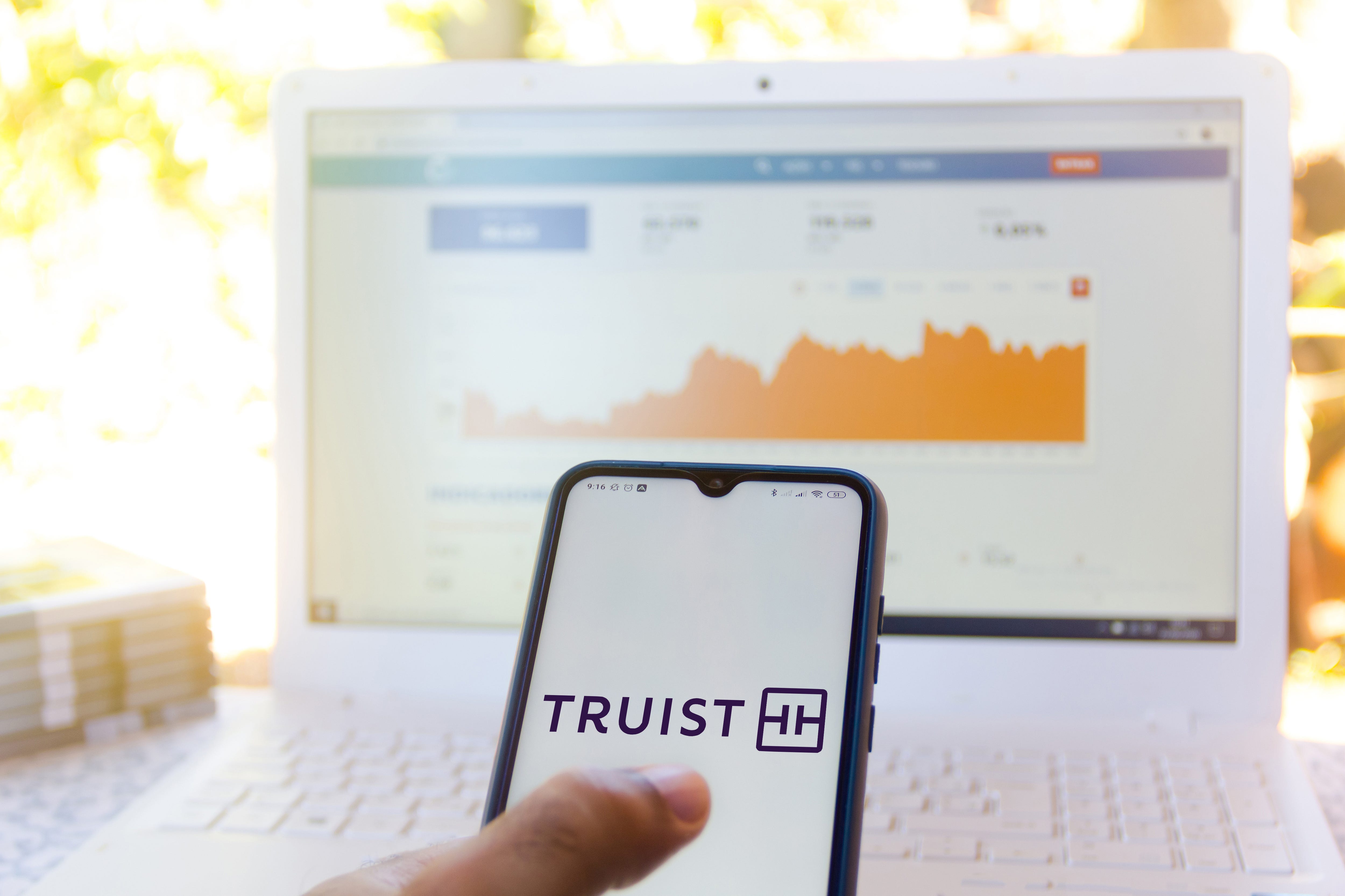 In this photo illustration the Truist Financial Corporation logo seen displayed on a smartphone.